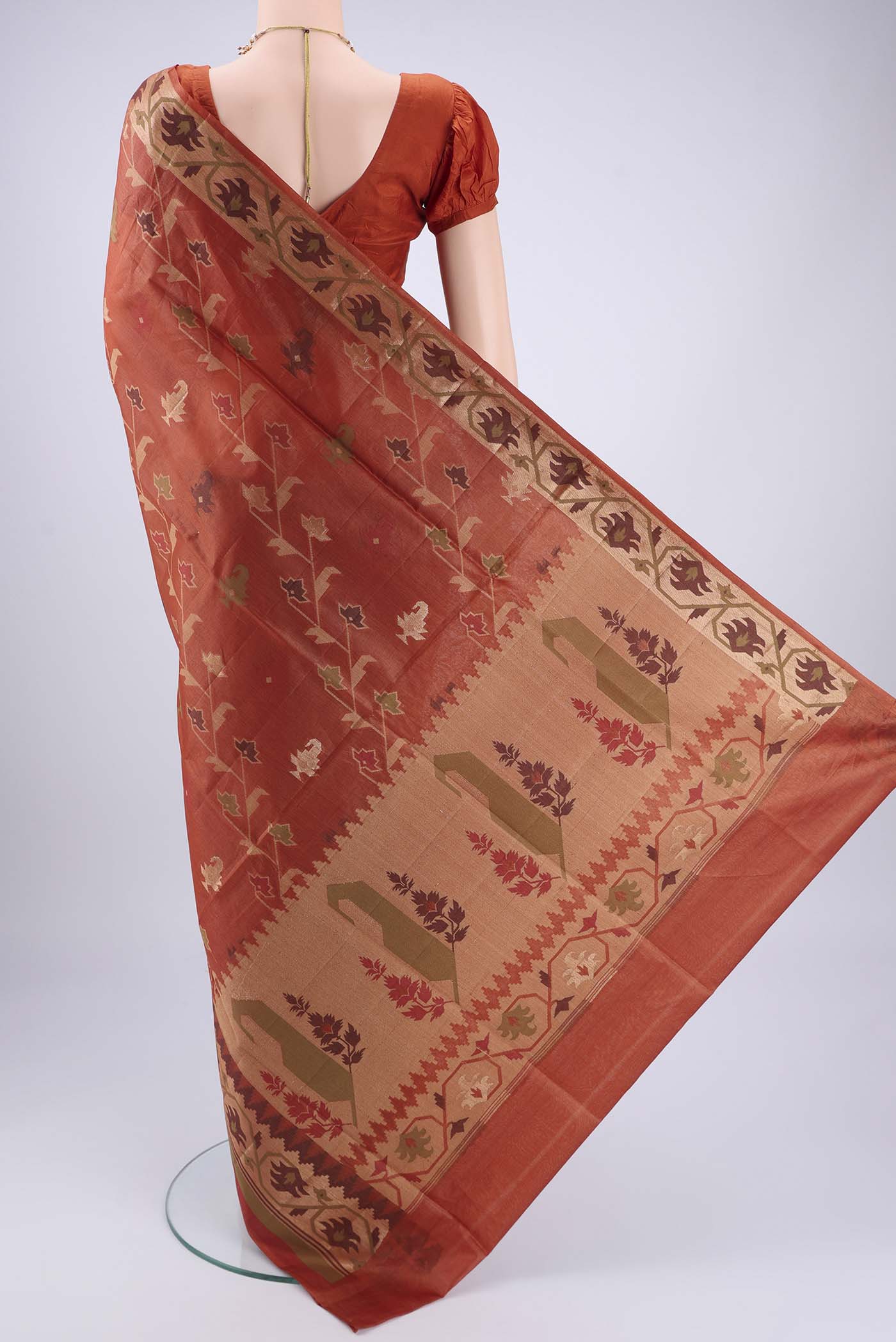 Flat view of Rust Banarasi Tussar Silk Saree with Thread Brocade on the body and Temple Border. 