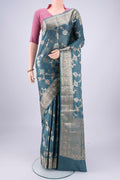 Maya Blue Banarasi Tussar Silk Saree with Zari Brocade on the body and Zari And Thread Border.  displayed on a mannequin