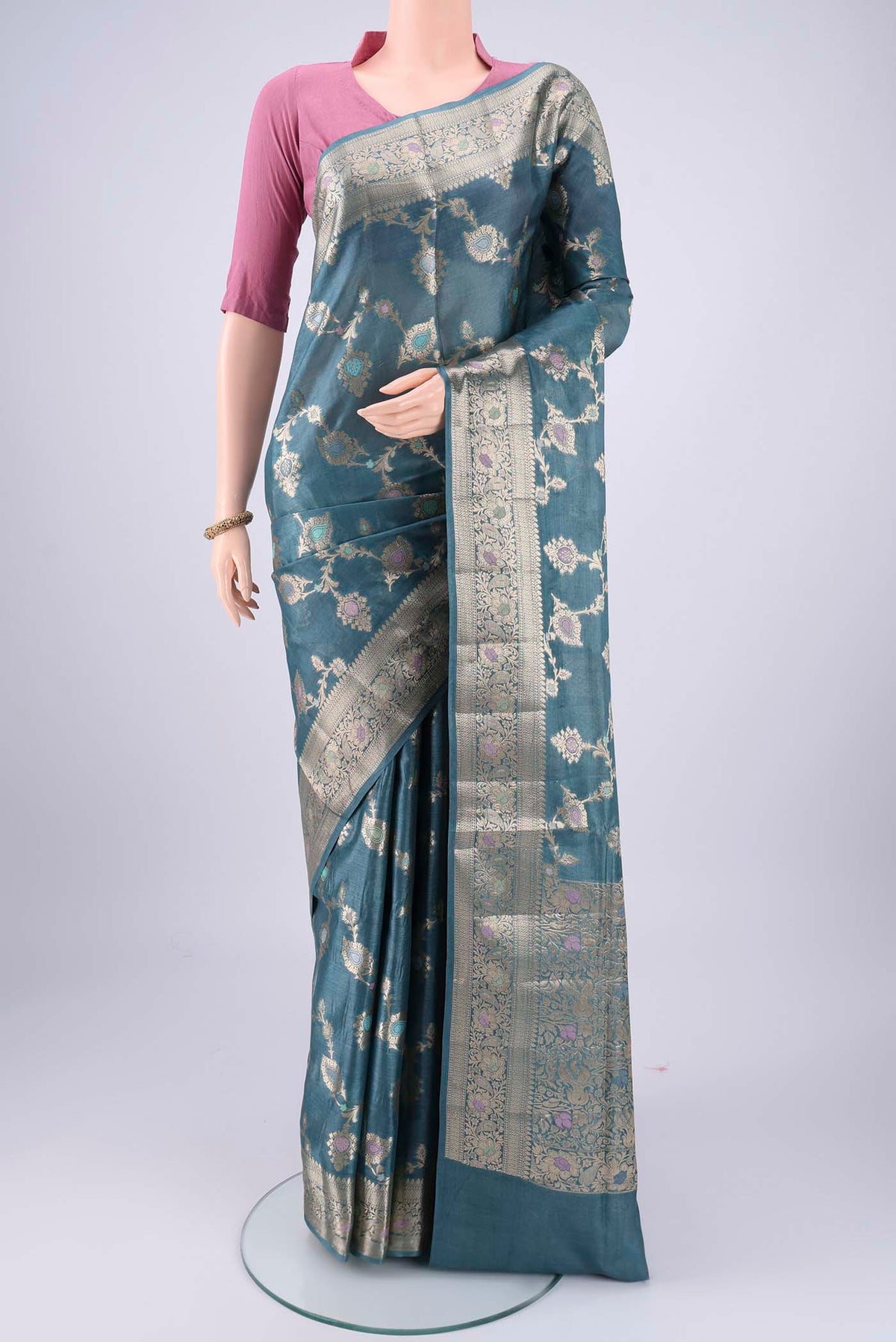 Maya Blue Banarasi Tussar Silk Saree with Zari Brocade on the body and Zari And Thread Border.  displayed on a mannequin