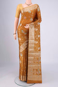 Mustard Banarasi Tussar Silk Saree with Zari And Thread Butta on the body and Zari And Thread Border.  displayed on a mannequin