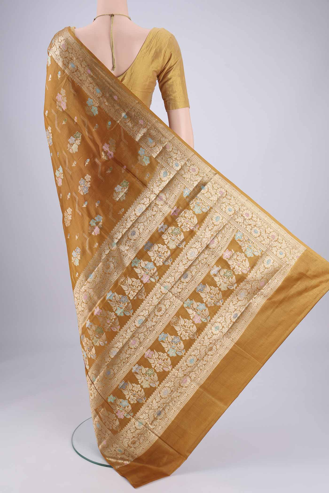 Flat view of Mustard Banarasi Tussar Silk Saree with Zari And Thread Butta on the body and Zari And Thread Border. 