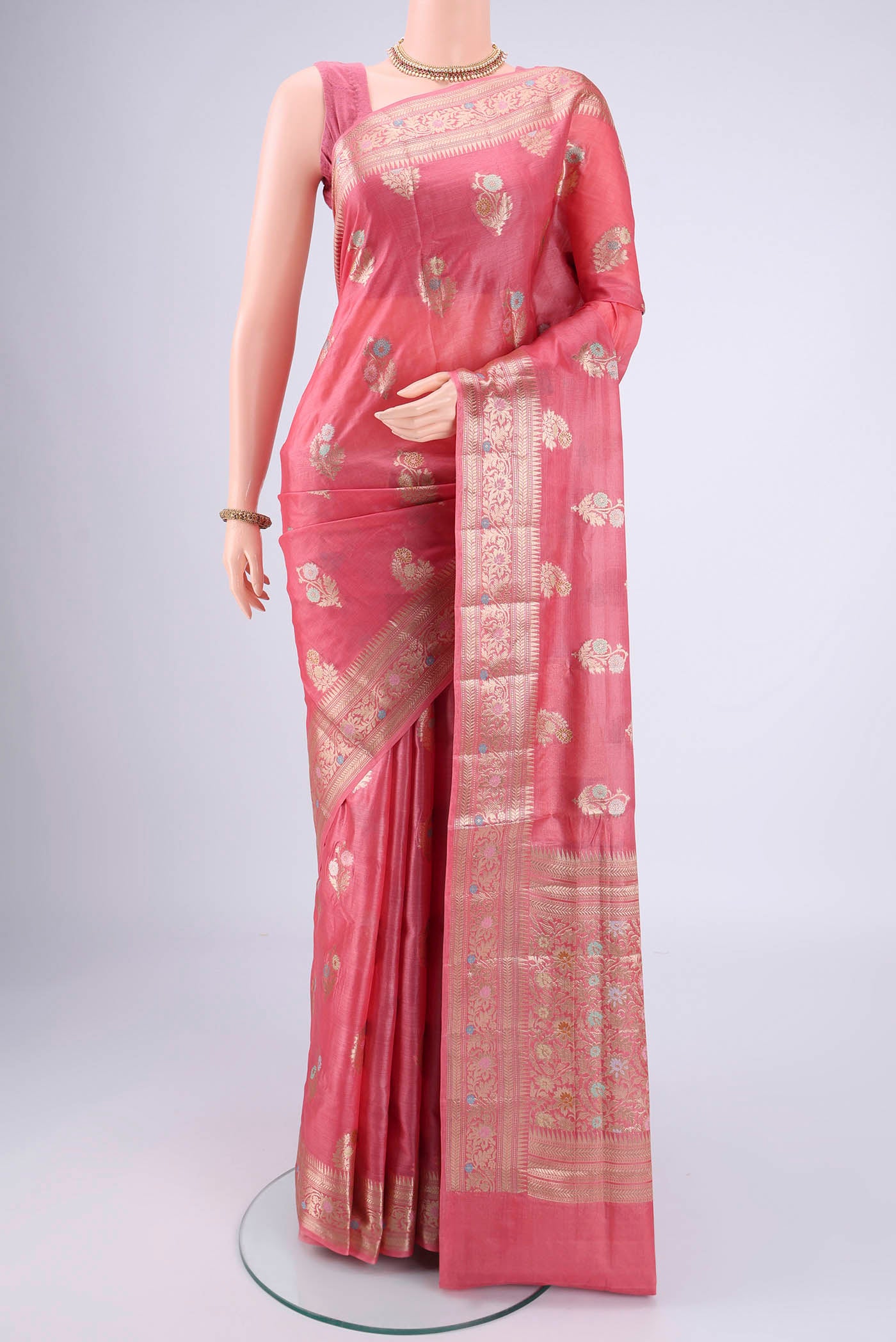 Pink Banarasi Tussar Silk Saree with Zari And Thread Butta on the body and Zari And Thread Border.  displayed on a mannequin