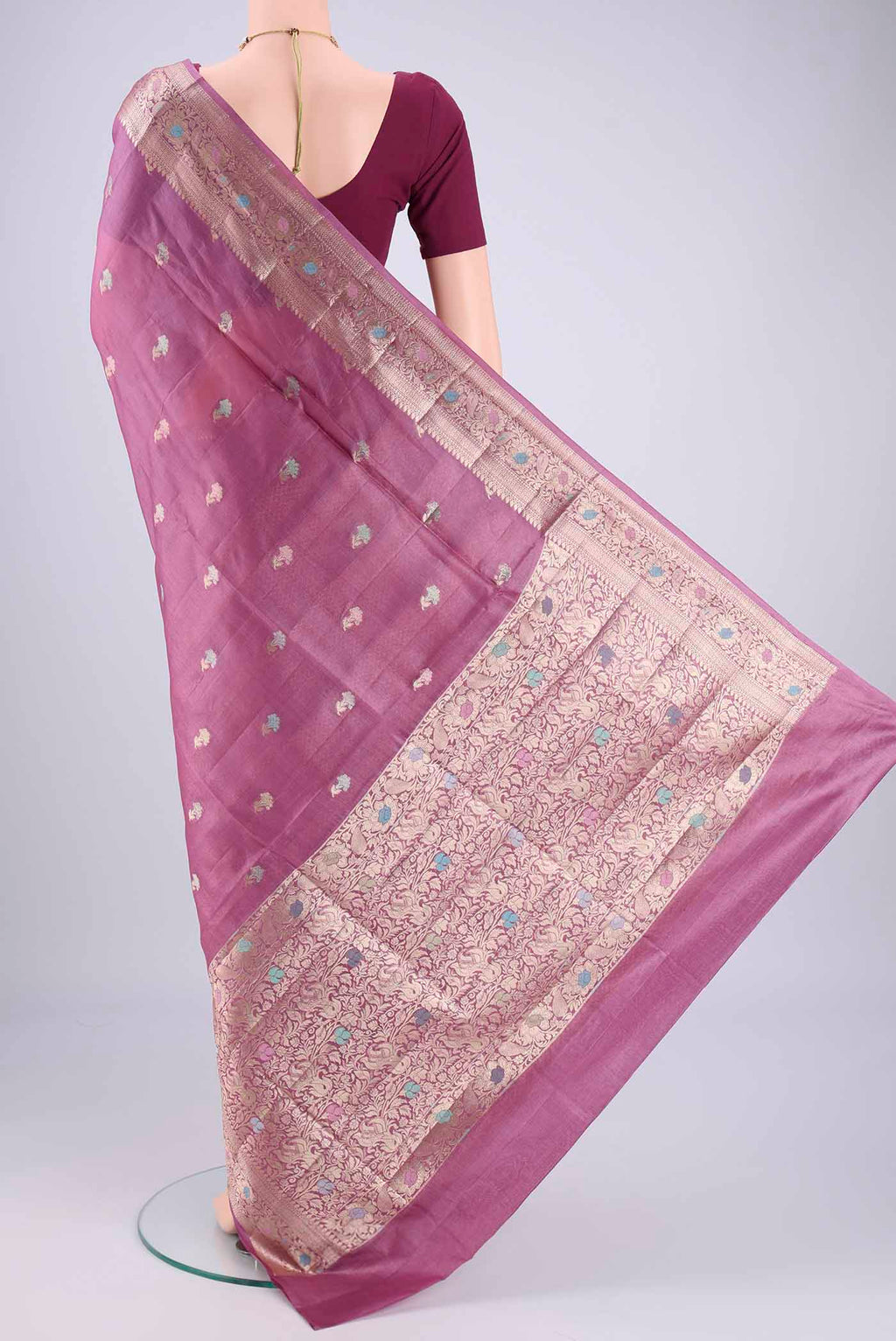 Flat view of Light Magenta Banarasi Tussar Silk Saree with Zari And Thread Butta on the body and Zari And Thread Border. 