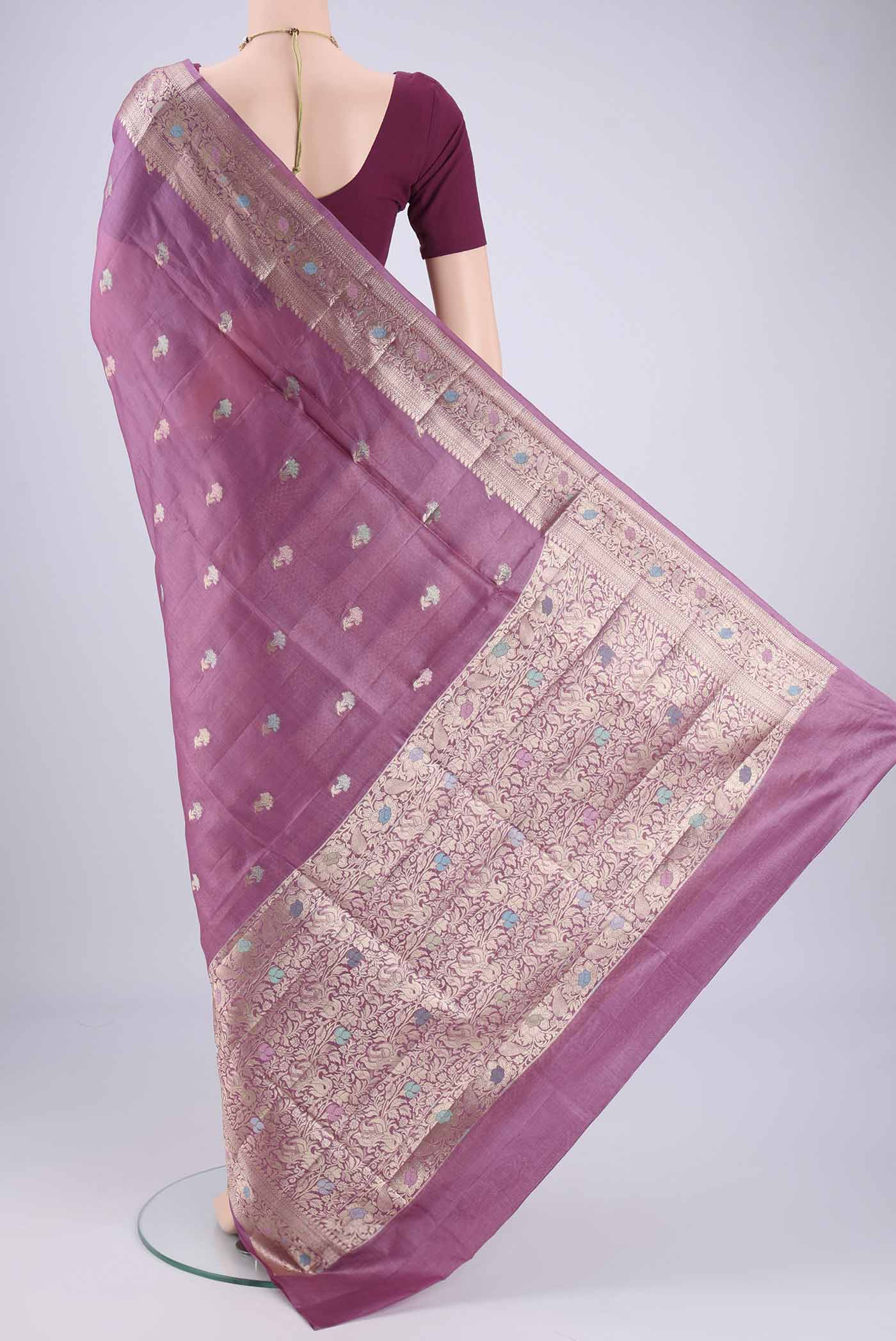 Flat view of Light Magenta Banarasi Tussar Silk Saree with Zari And Thread Butta on the body and Zari And Thread Border. 