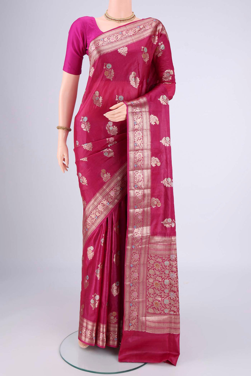 Rani Pink Banarasi Tussar Silk Saree with Zari And Thread Butta on the body and Zari And Thread Border.  displayed on a mannequin