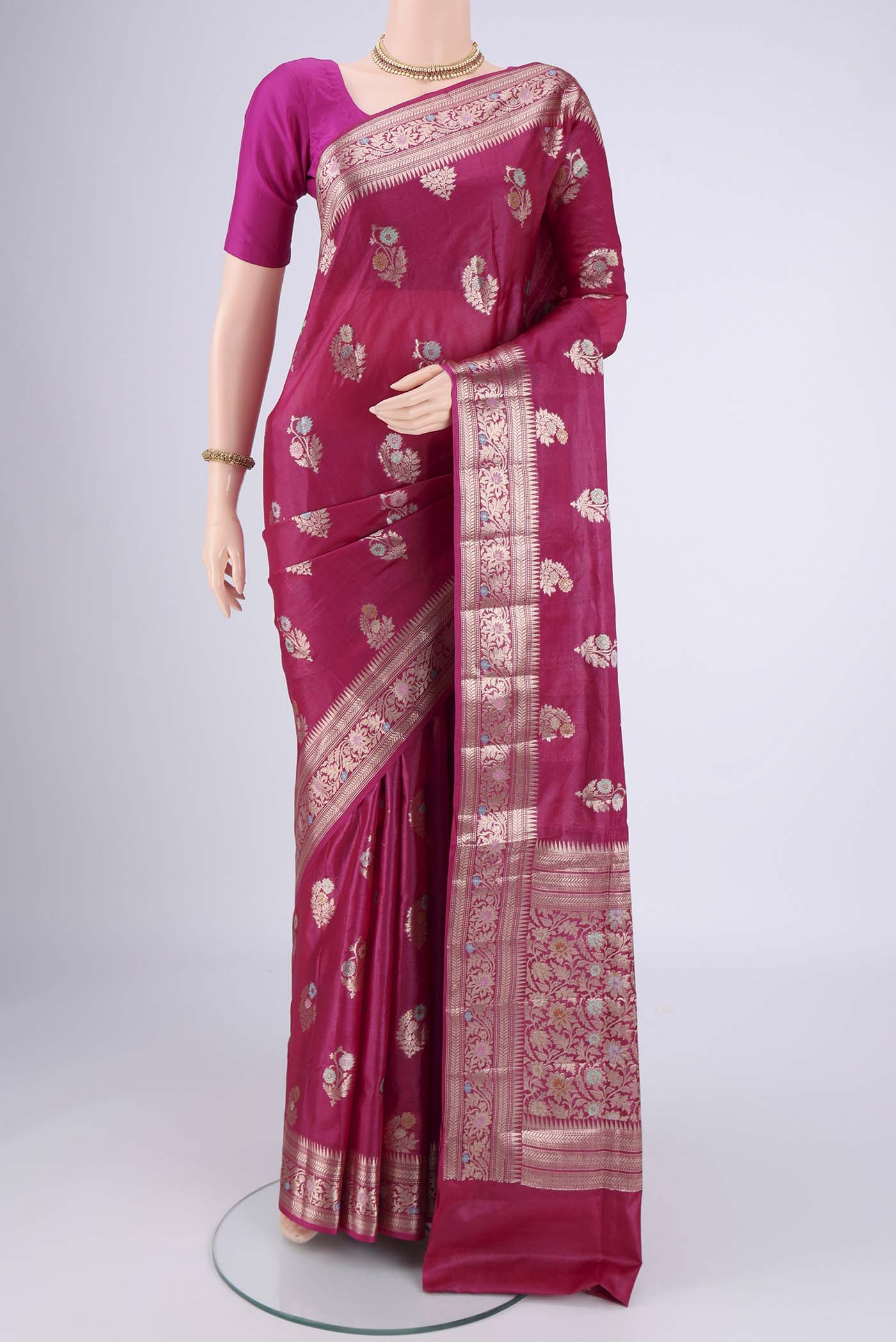 Rani Pink Banarasi Tussar Silk Saree with Zari And Thread Butta on the body and Zari And Thread Border.  displayed on a mannequin