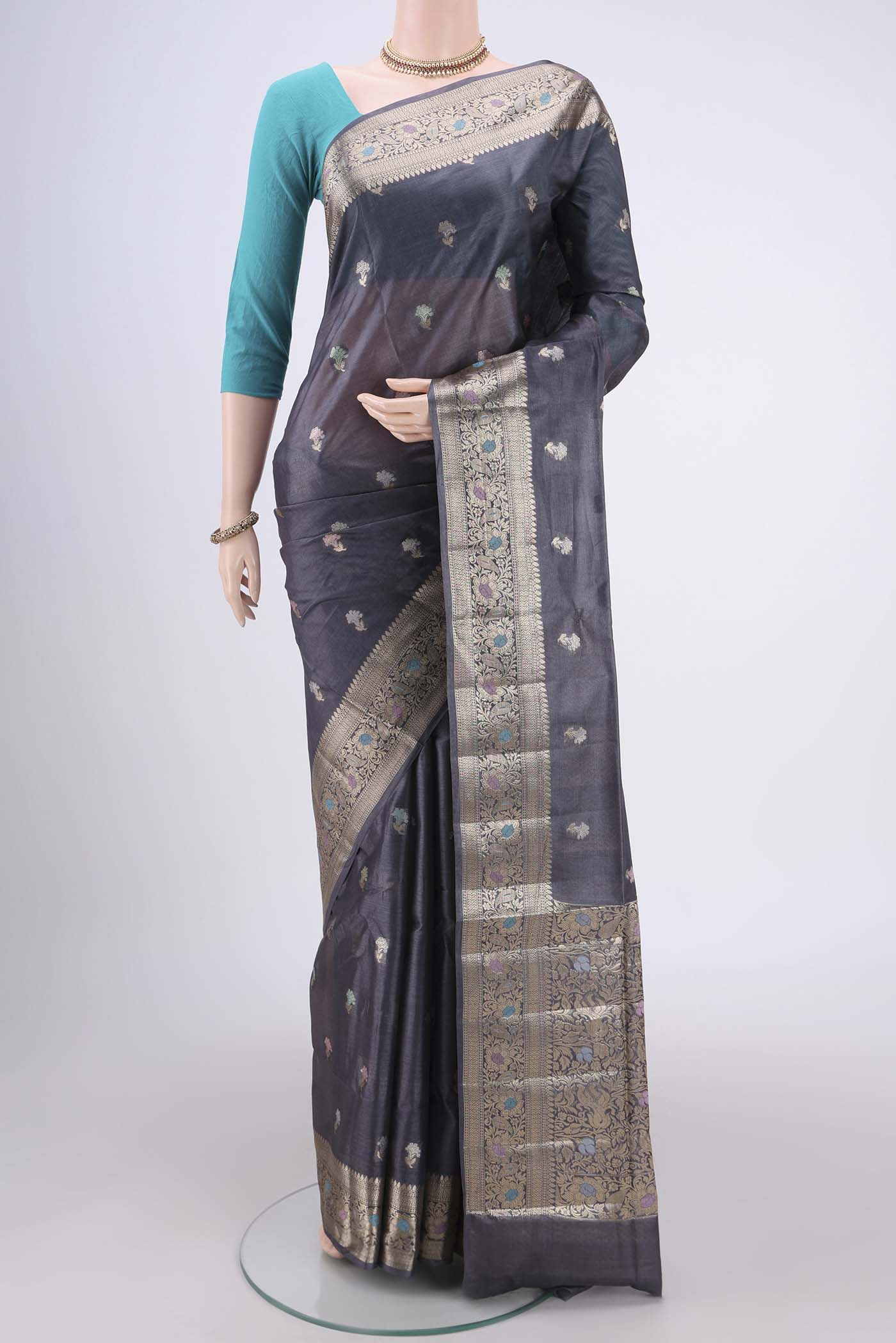 Davys Grey Banarasi Tussar Silk Saree with Zari And Thread Butta on the body and Zari And Thread Border.  displayed on a mannequin
