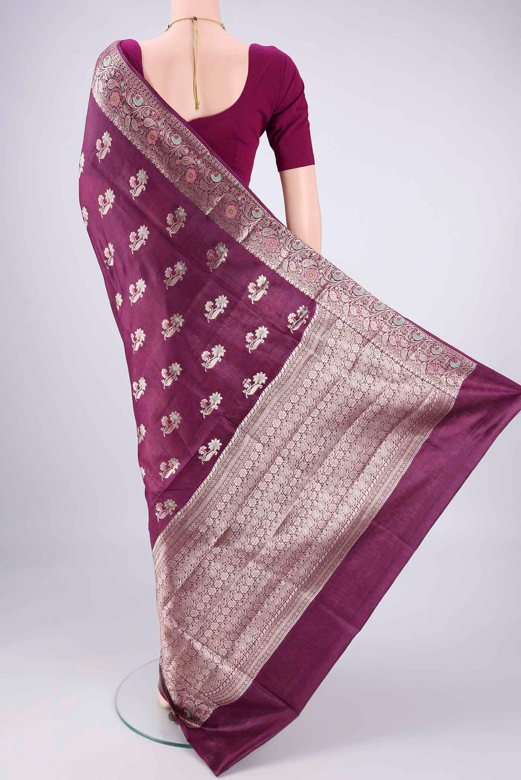 Flat view of Burgundy Banarasi Tussar Silk Saree with Zari And Thread Butta on the body and Zari Border. 