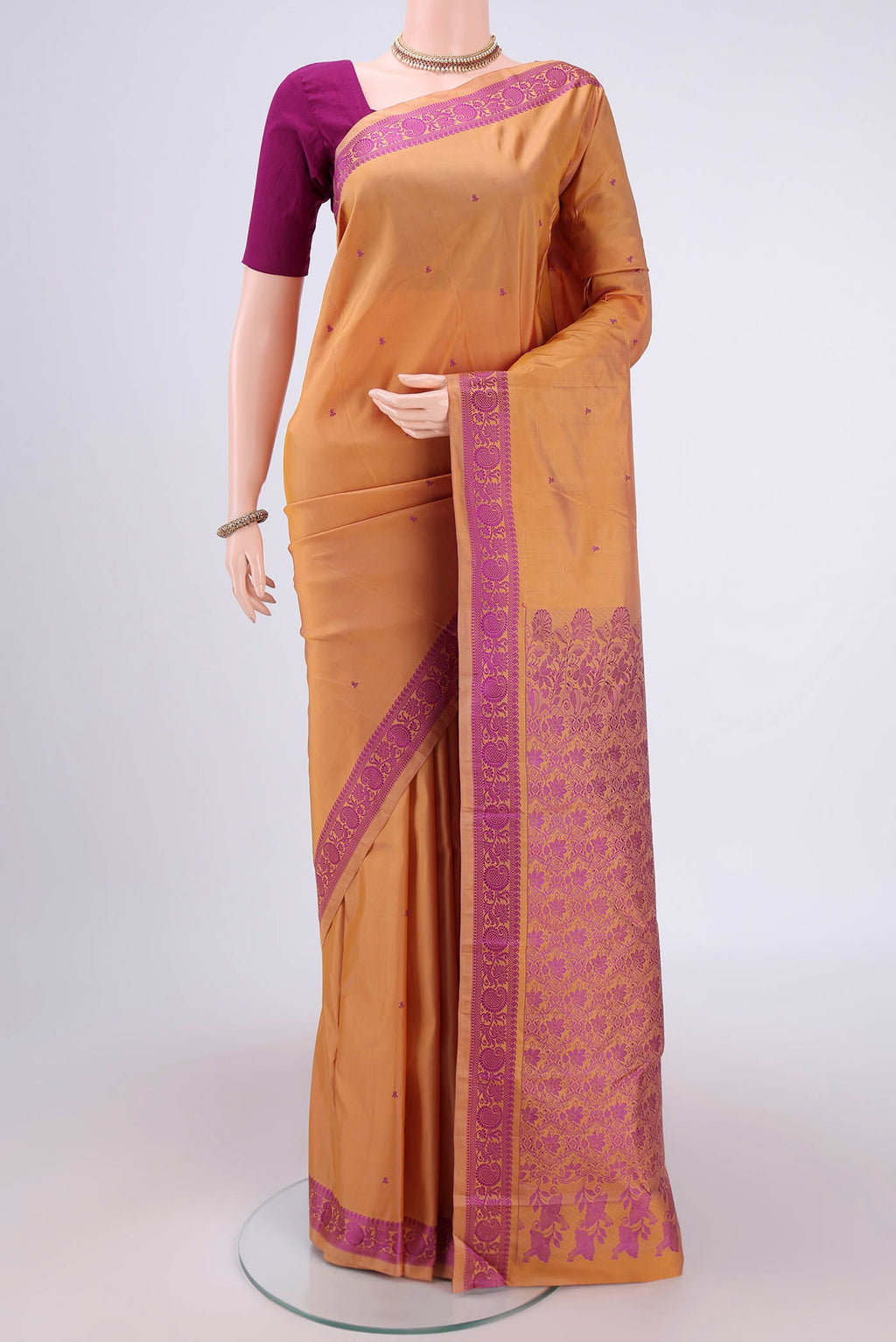 Sandal Kanchipuram Silk Saree with Thread Butta on the body and Thread Border.  displayed on a mannequin