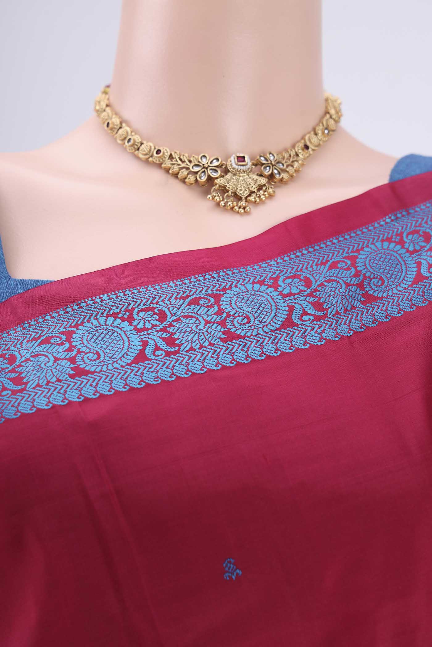 Border image of Maroon Kanchipuram Silk Saree with Thread Butta on the body and Thread Border. 