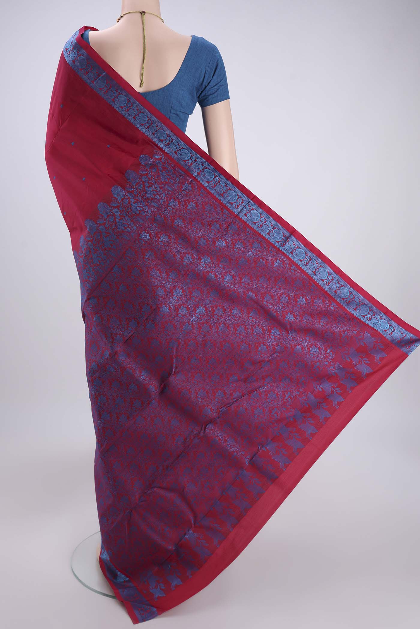 Flat view of Maroon Kanchipuram Silk Saree with Thread Butta on the body and Thread Border. 