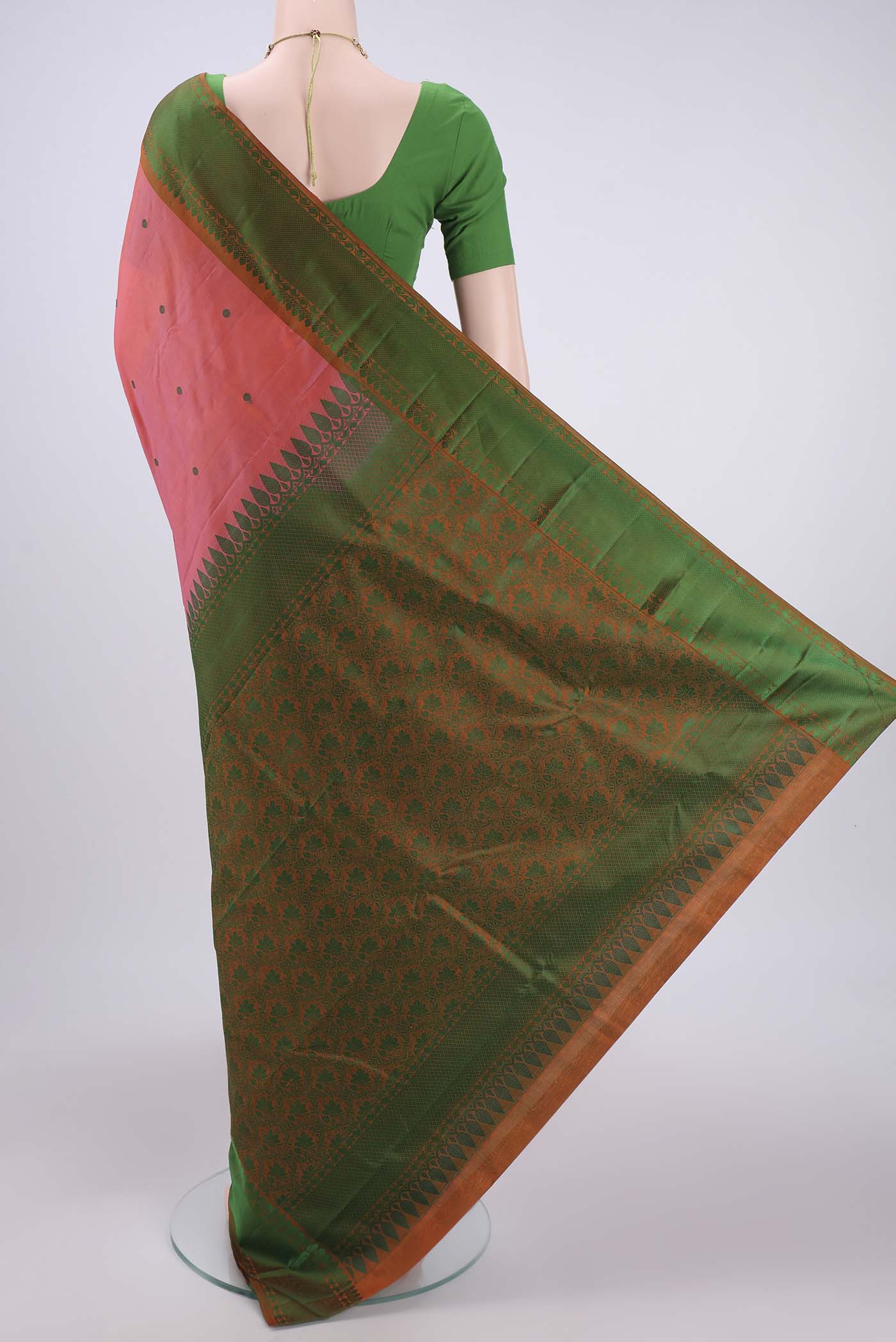 Flat view of Peach Kanchipuram Silk Saree with Thread Butta on the body and Thread Border. 