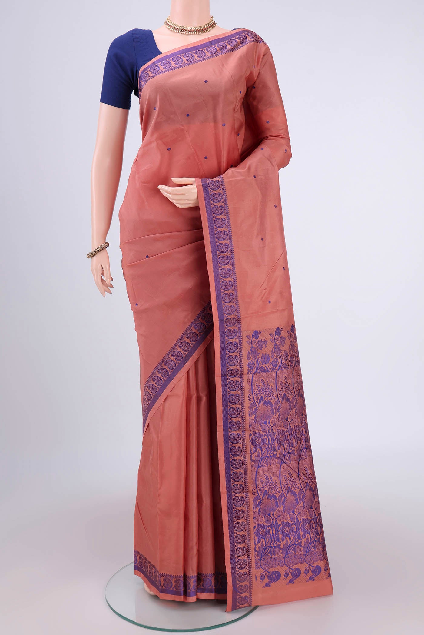 Coral Dual Tone Kanchipuram Silk Saree with Thread Butta on the body and Thread Border.  displayed on a mannequin