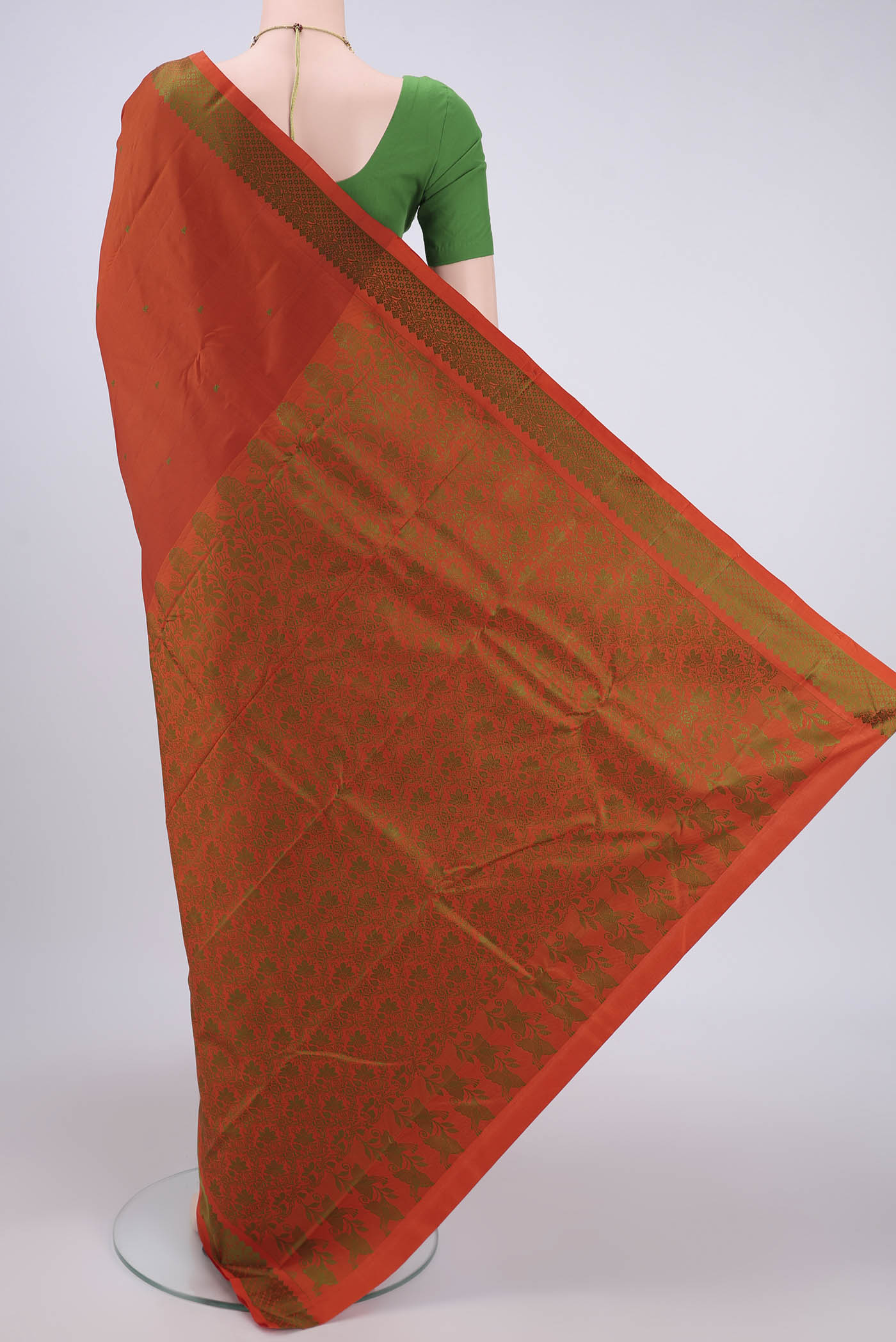 Flat view of Rust Kanchipuram Silk Saree with Thread Butta on the body and Thread Border. 
