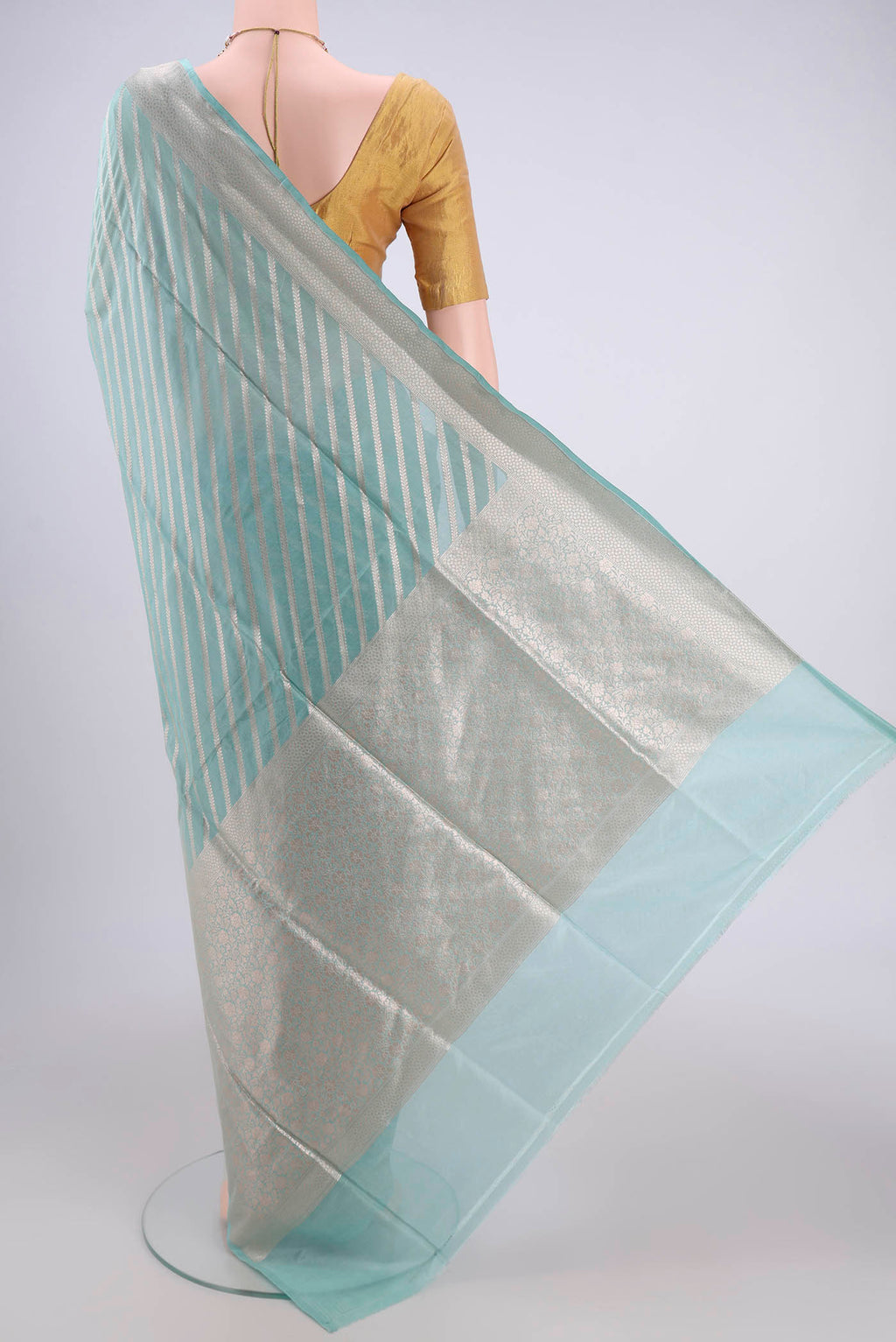 Flat view of Sea Green Dual Tone Banarasi Silk Saree with Stripes on the body and Zari Border. 
