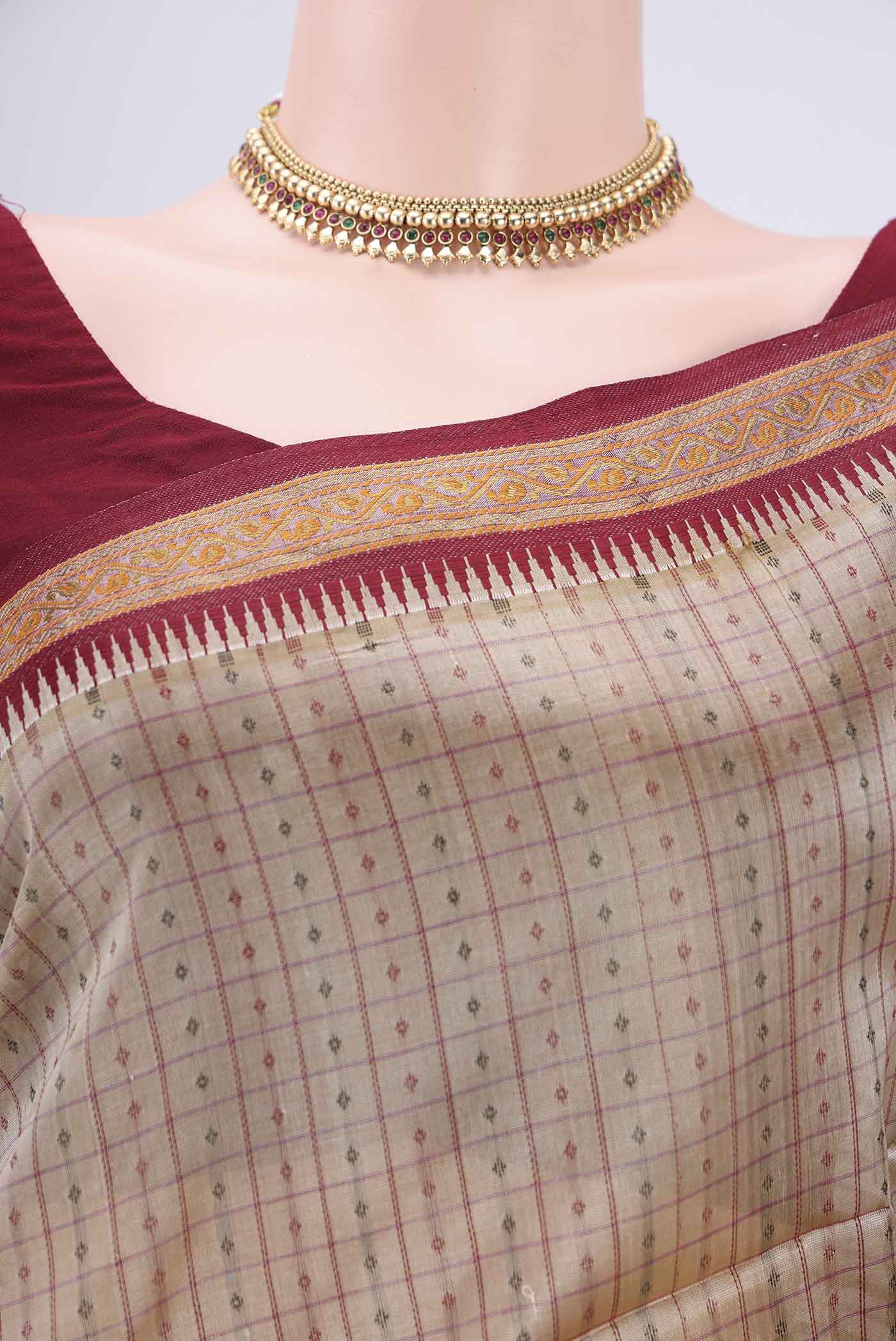 Border image of Beige Silk Cotton Saree with Checked design on the body and Zari And Thread Border. 