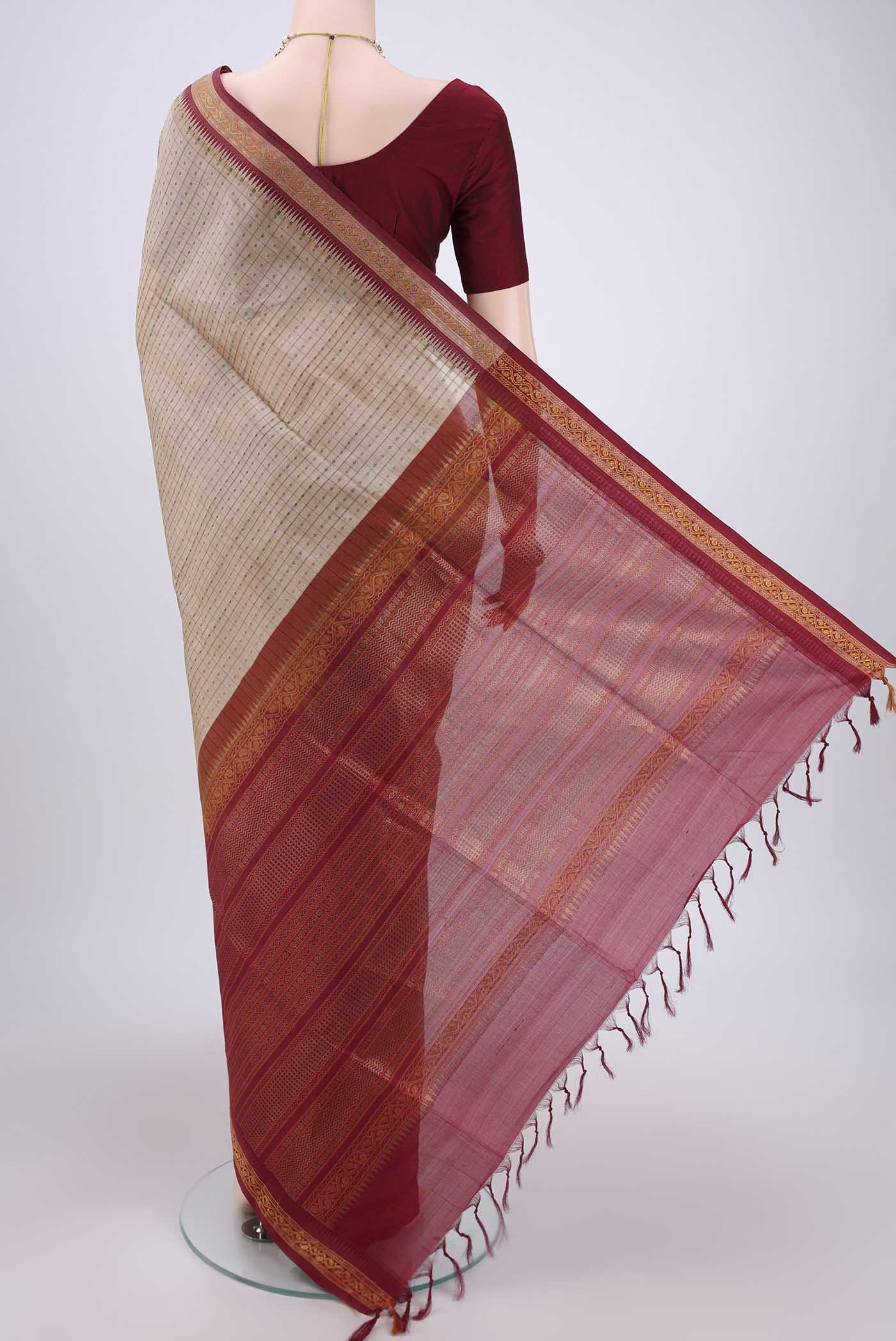 Flat view of Beige Silk Cotton Saree with Checked design on the body and Zari And Thread Border. 