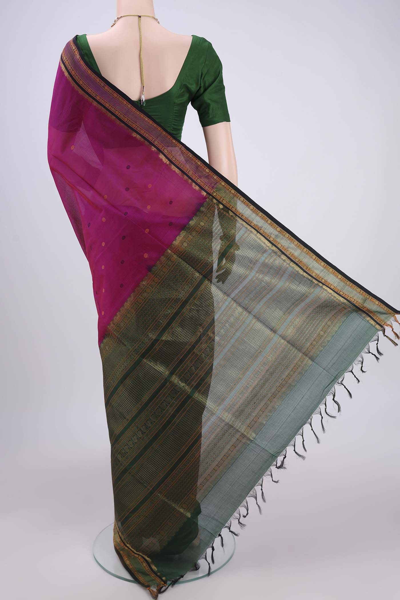 Flat view of Rani Pink Silk Cotton Saree with Thread Butta on the body and Zari And Thread Border. 