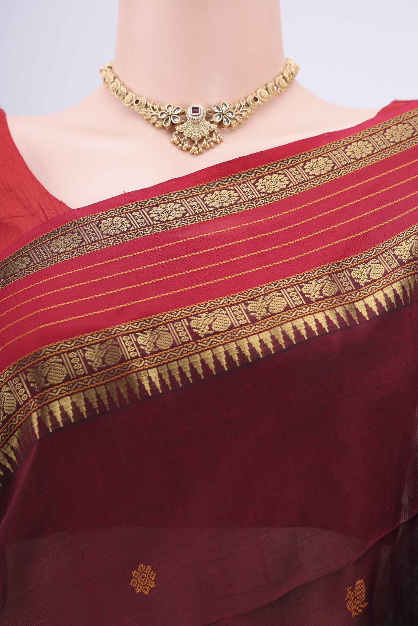 Border image of Maroon Coimbatore Silk Cotton Saree with Zari Butta on the body and Plain Border. 