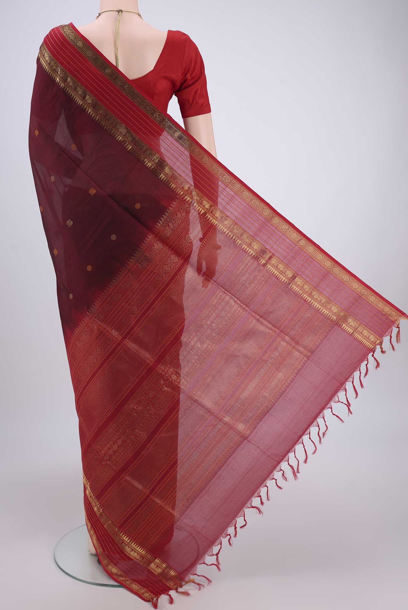 Flat view of Maroon Coimbatore Silk Cotton Saree with Zari Butta on the body and Plain Border. 