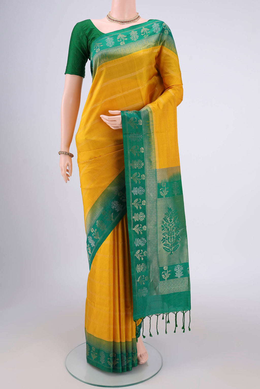 Orange with Pink Dual Tone Soft Silk Saree with Stripes on the body and Zari Border.  displayed on a mannequin