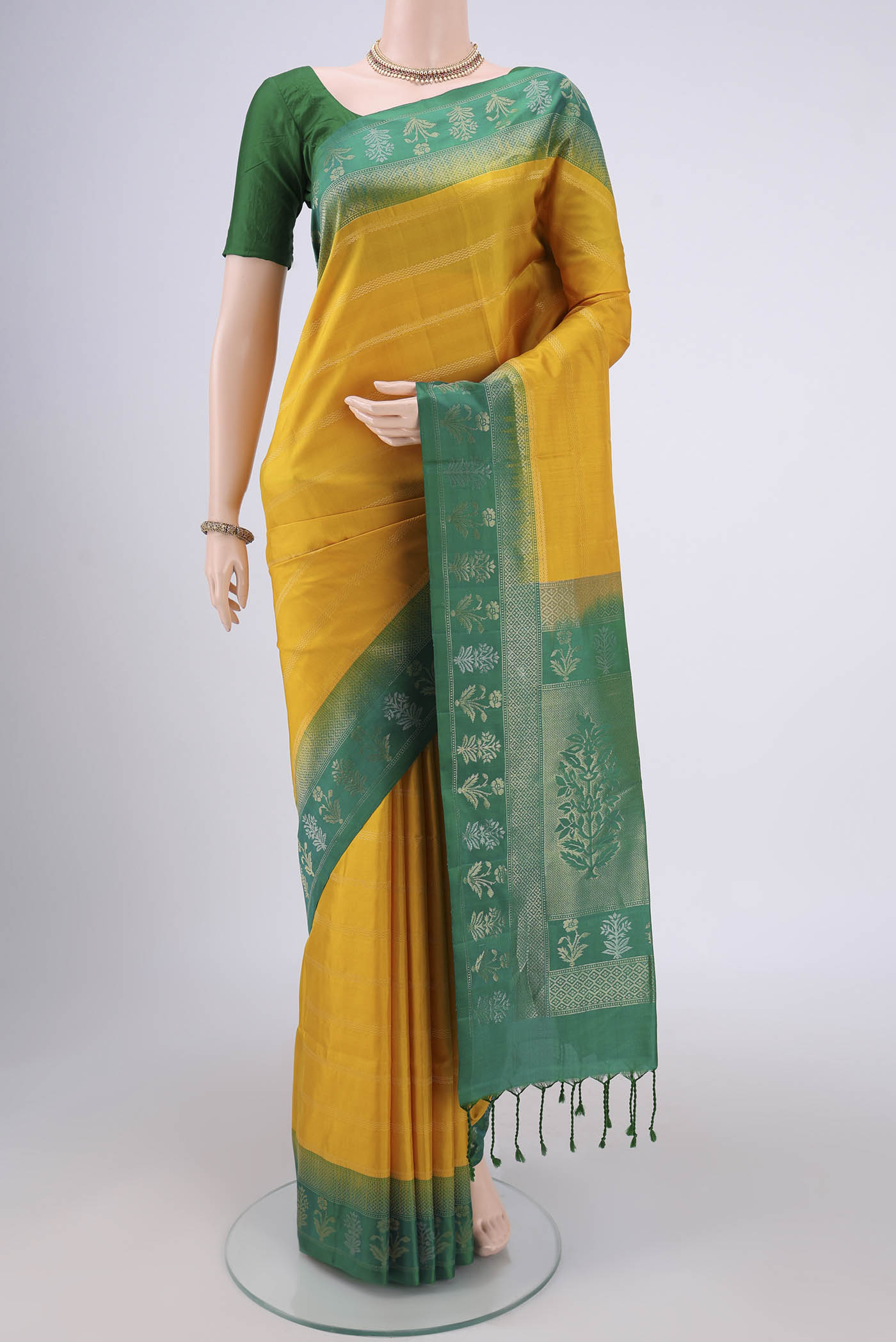 Orange with Pink Dual Tone Soft Silk Saree with Stripes on the body and Zari Border.  displayed on a mannequin