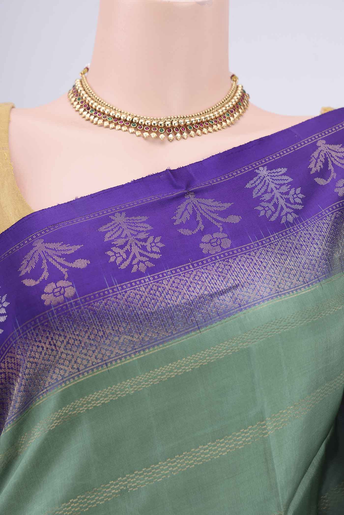 Border image of Sage Green Soft Silk Saree with Stripes on the body and Zari Border. 