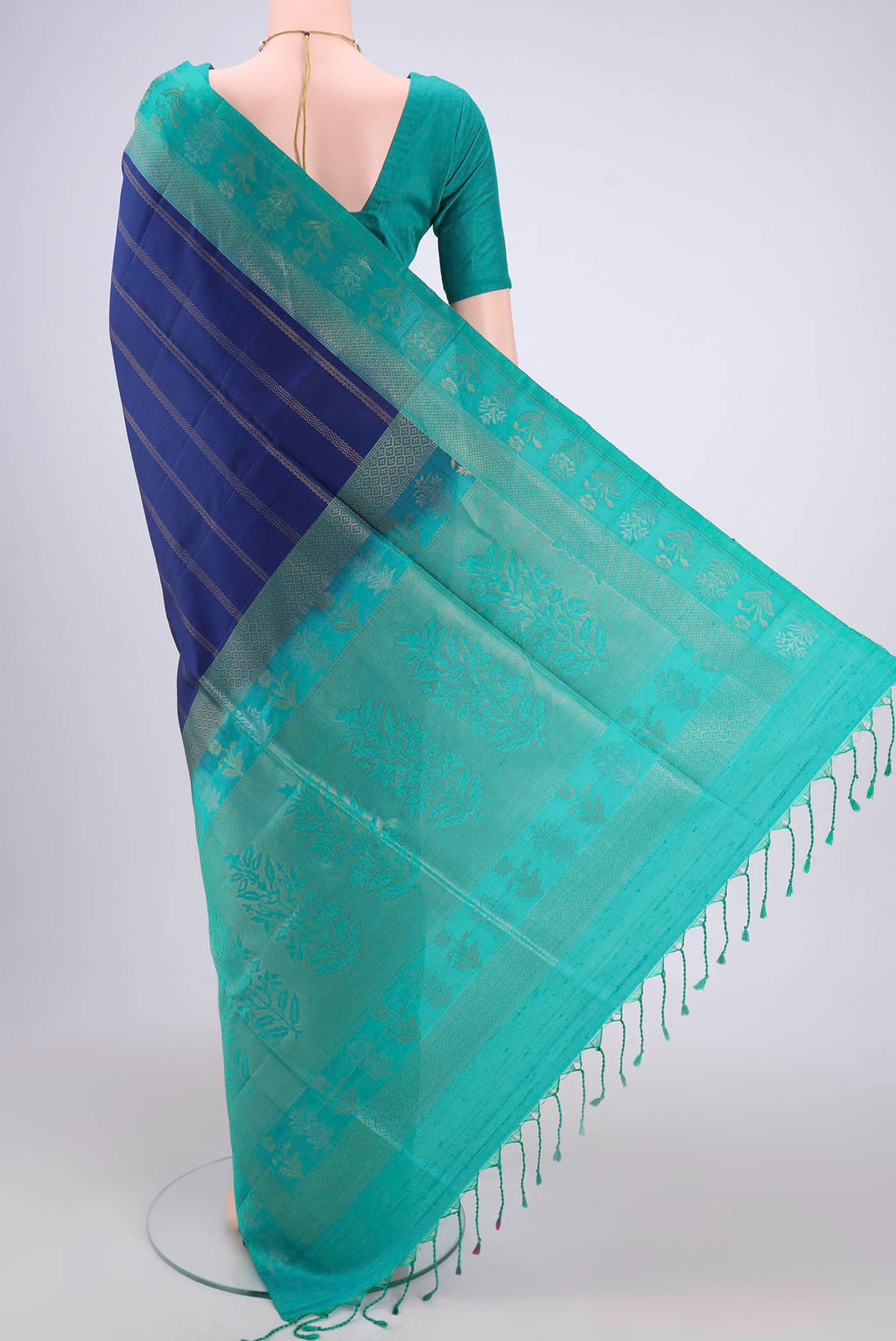 Flat view of Navy Blue Soft Silk Saree with Stripes on the body and Zari Border. 