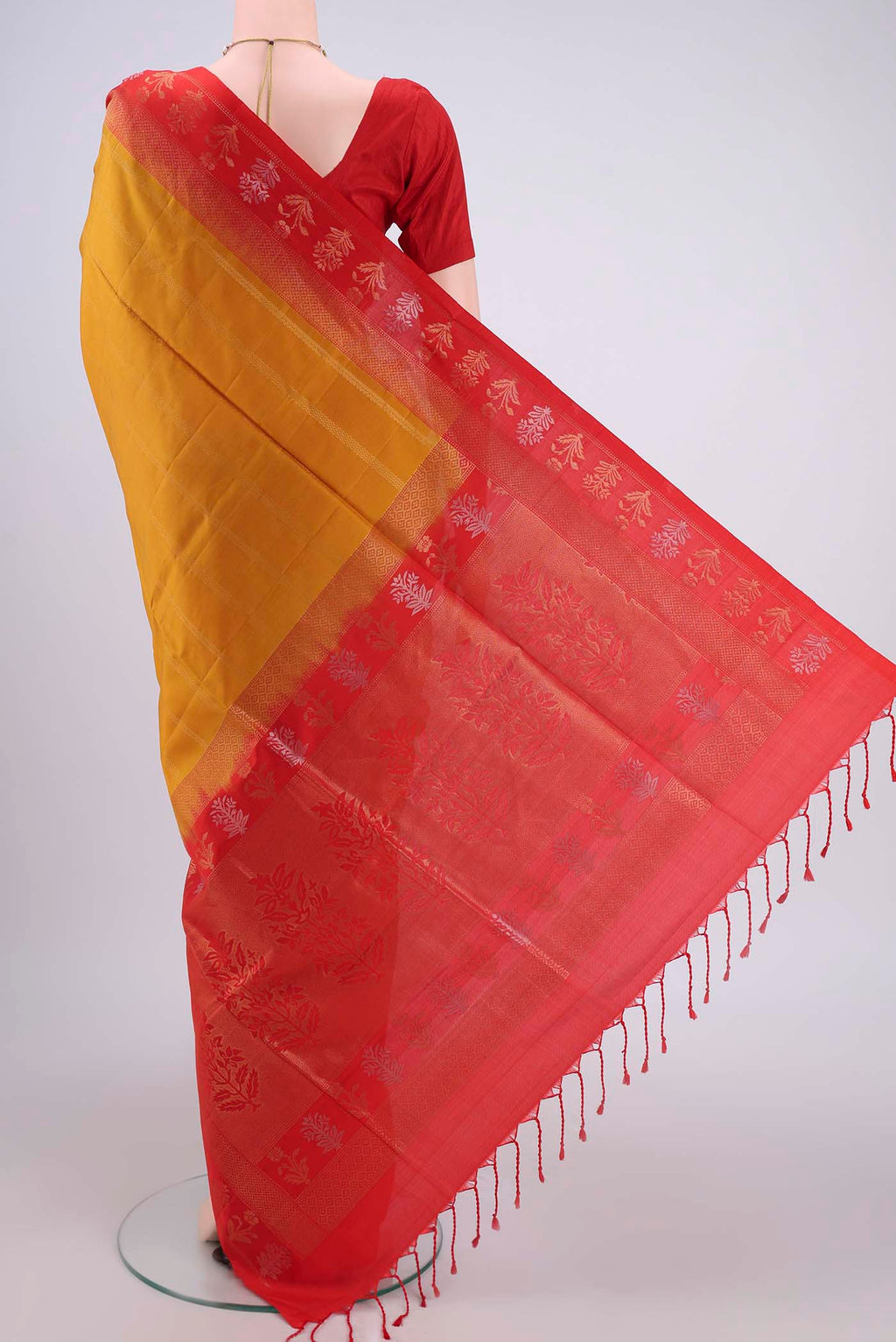 Flat view of Mustard Soft Silk Saree with Stripes on the body and Zari Border. 