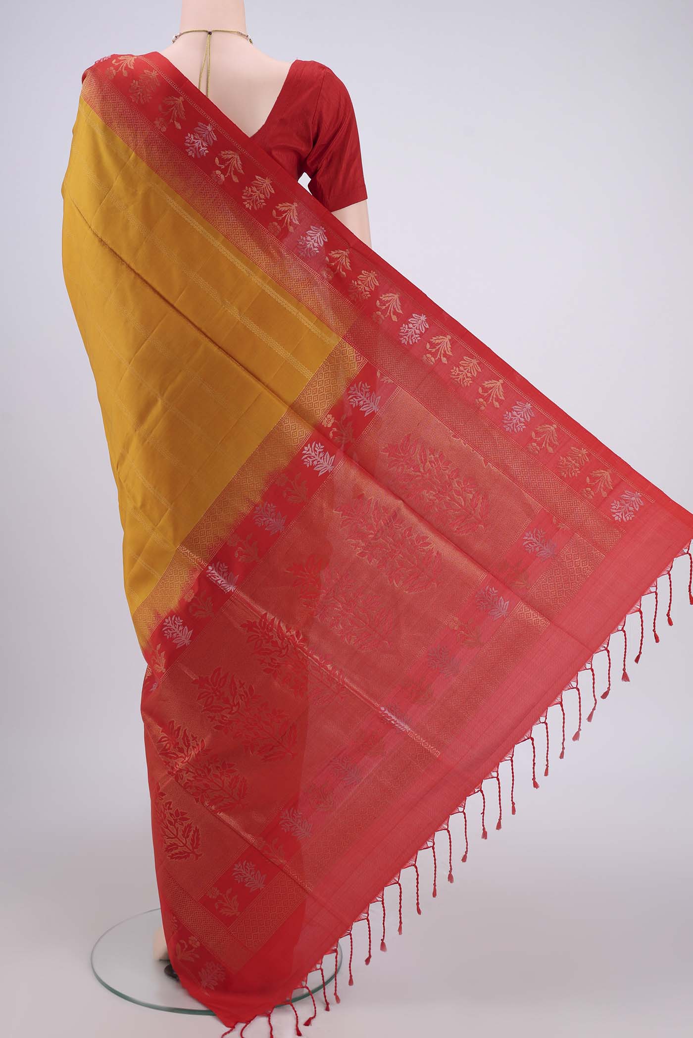Flat view of Mustard Soft Silk Saree with Stripes on the body and Zari Border. 