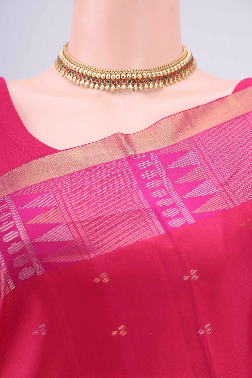 Border image of Rani Pink Soft Silk Saree with Zari Butta on the body and Zari Border. 
