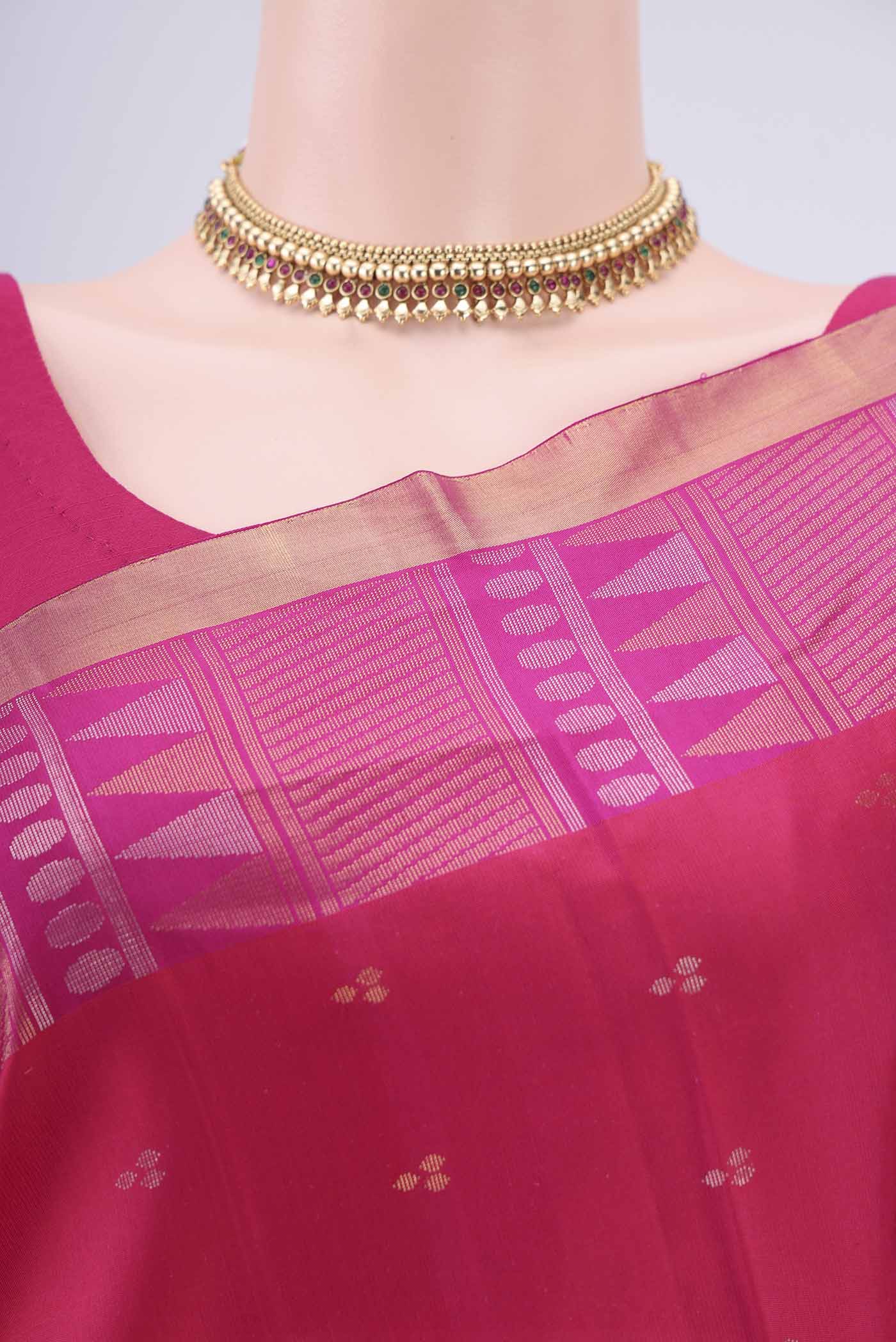 Border image of Rani Pink Soft Silk Saree with Zari Butta on the body and Zari Border. 