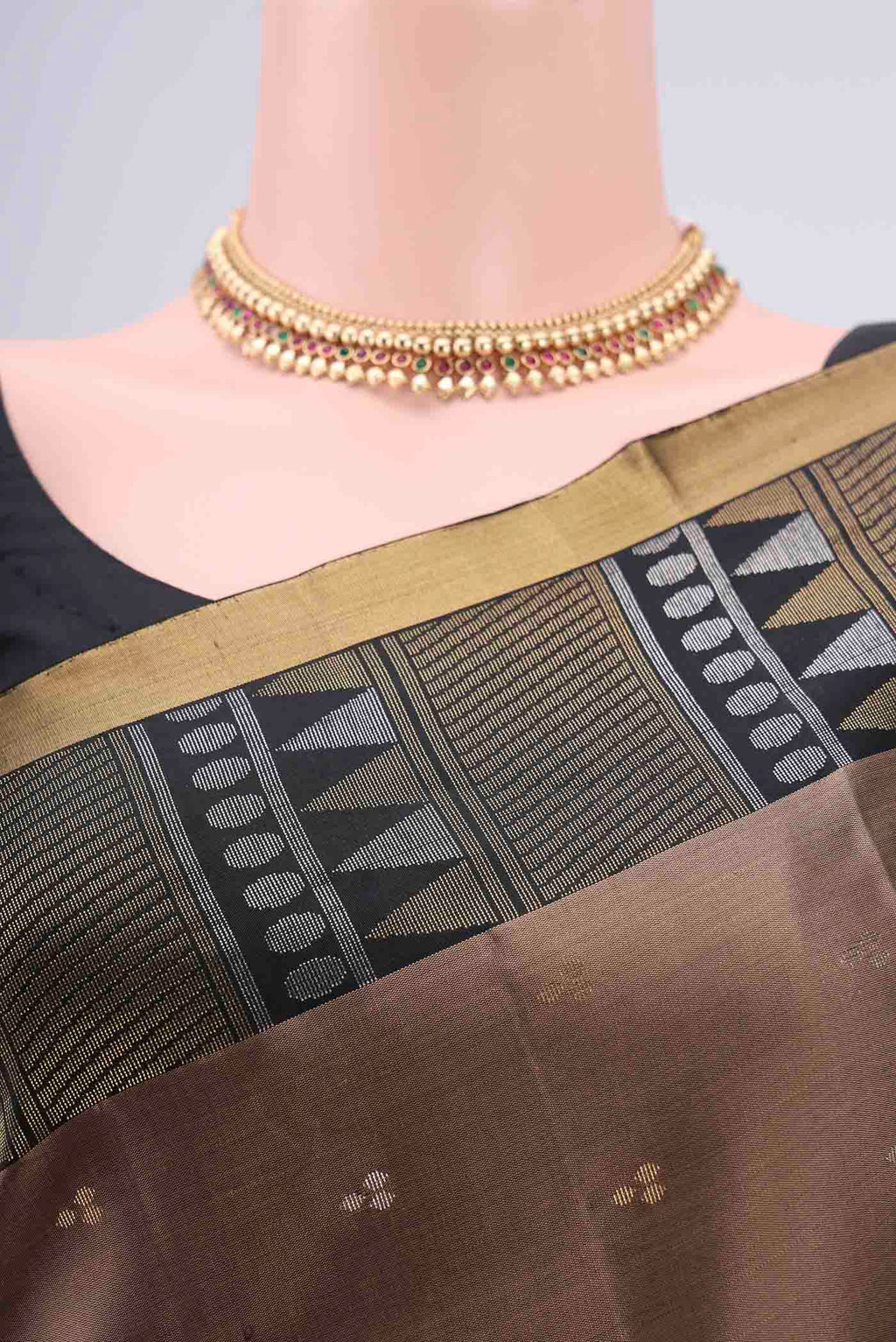 Border image of Brown Soft Silk Saree with Zari Butta on the body and Zari Border. 