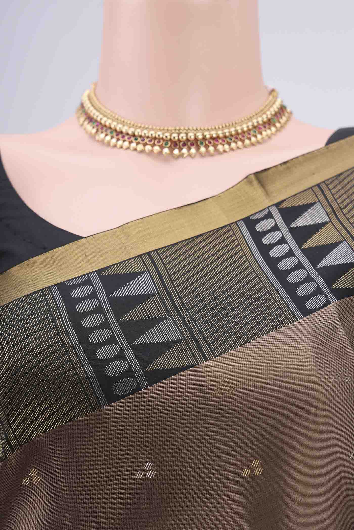 Border image of Brown Soft Silk Saree with Zari Butta on the body and Zari Border. 