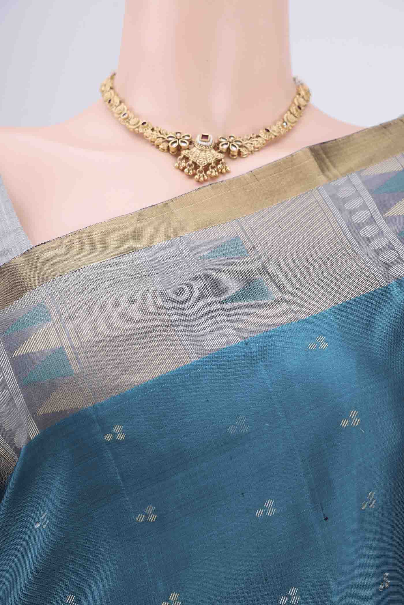 Border image of Peacock Blue Soft Silk Saree with Zari Butta on the body and Zari Border. 