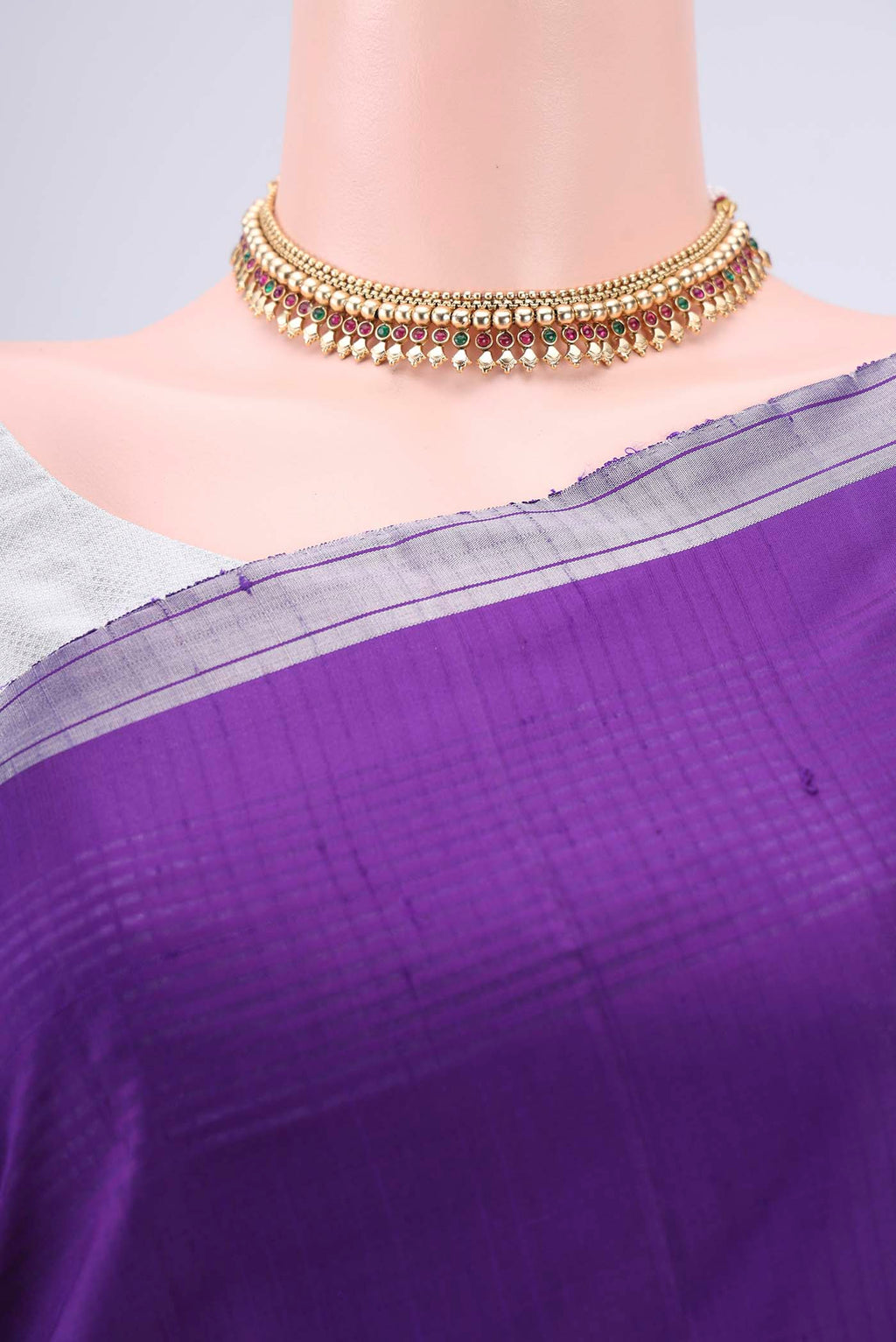 Border image of Purple Soft Silk Saree with Zari Butta on the body and Zari Border. 