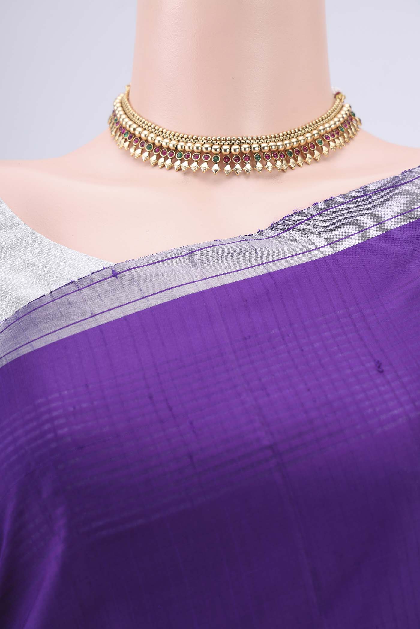 Border image of Purple Soft Silk Saree with Zari Butta on the body and Zari Border. 