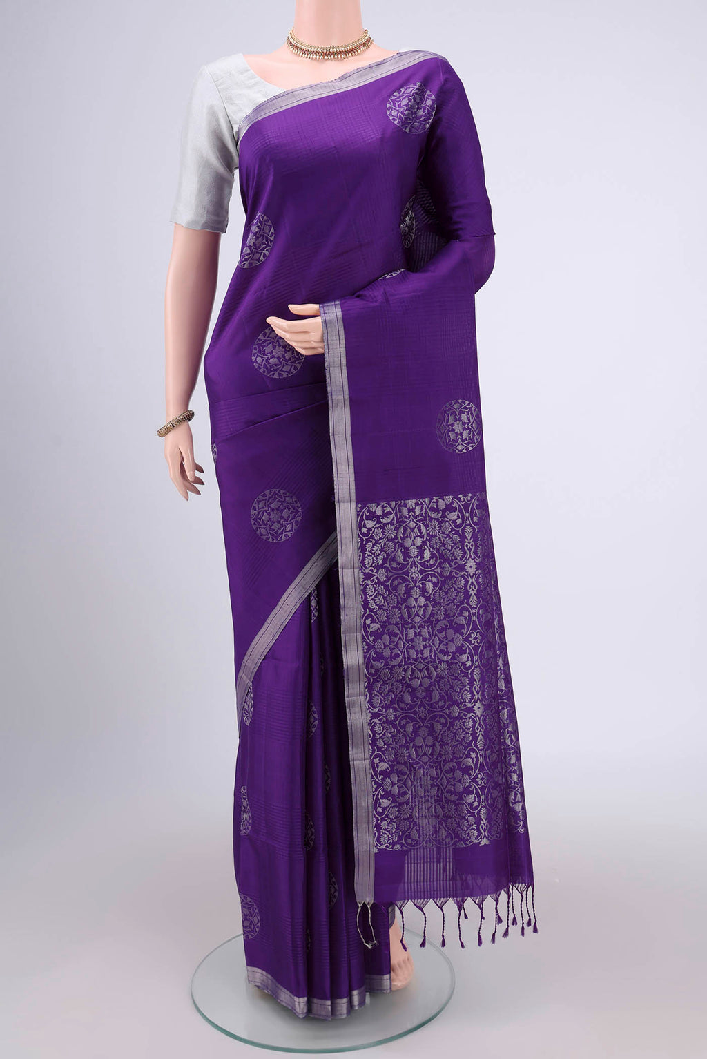 Purple Soft Silk Saree with Zari Butta on the body and Zari Border.  displayed on a mannequin