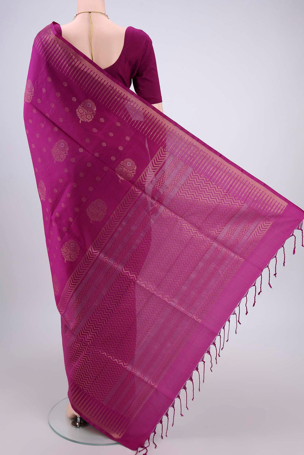Flat view of Magenta Soft Silk Saree with Zari Butta on the body and Zari Border. 