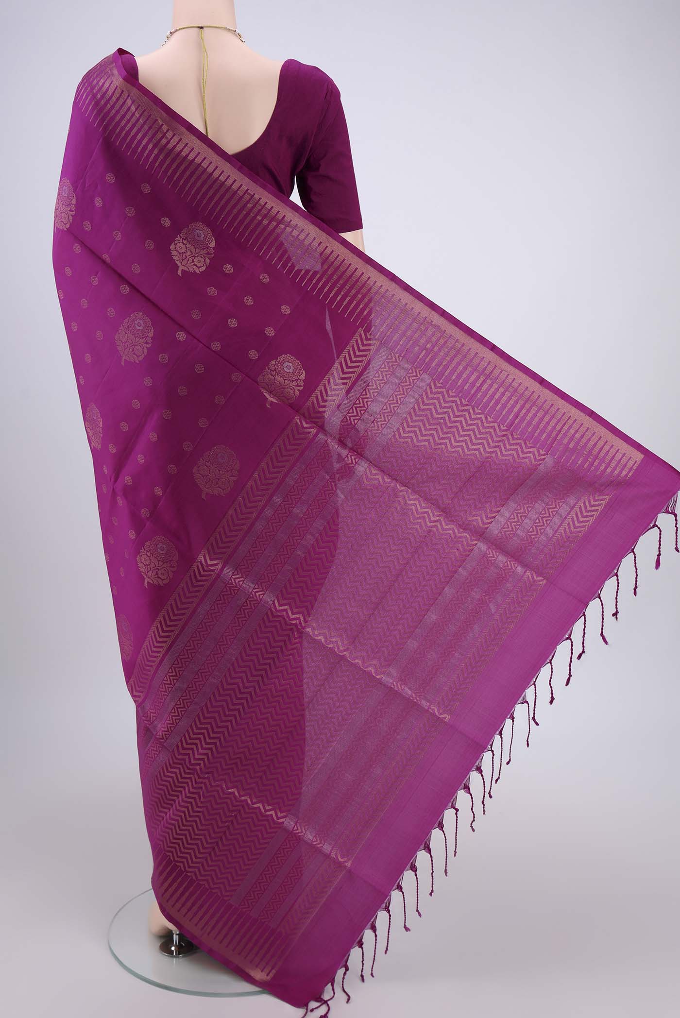 Flat view of Magenta Soft Silk Saree with Zari Butta on the body and Zari Border. 