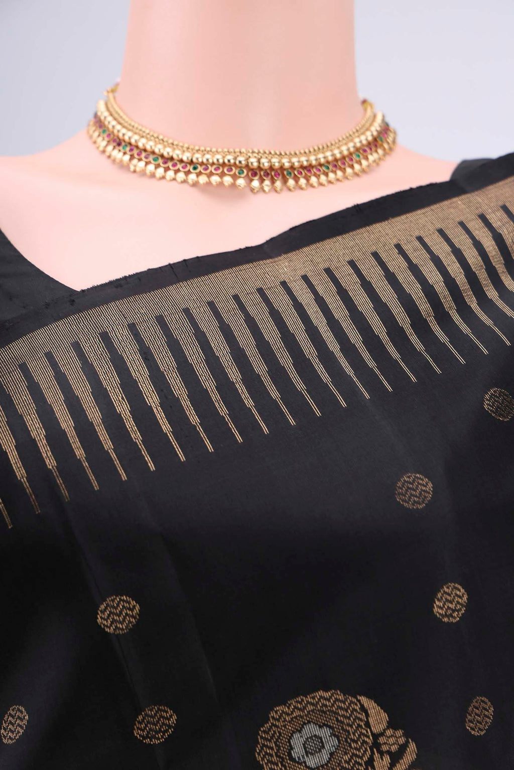 Border image of Black Baluchari Silk Saree with Zari Butta on the body and Zari Border. 