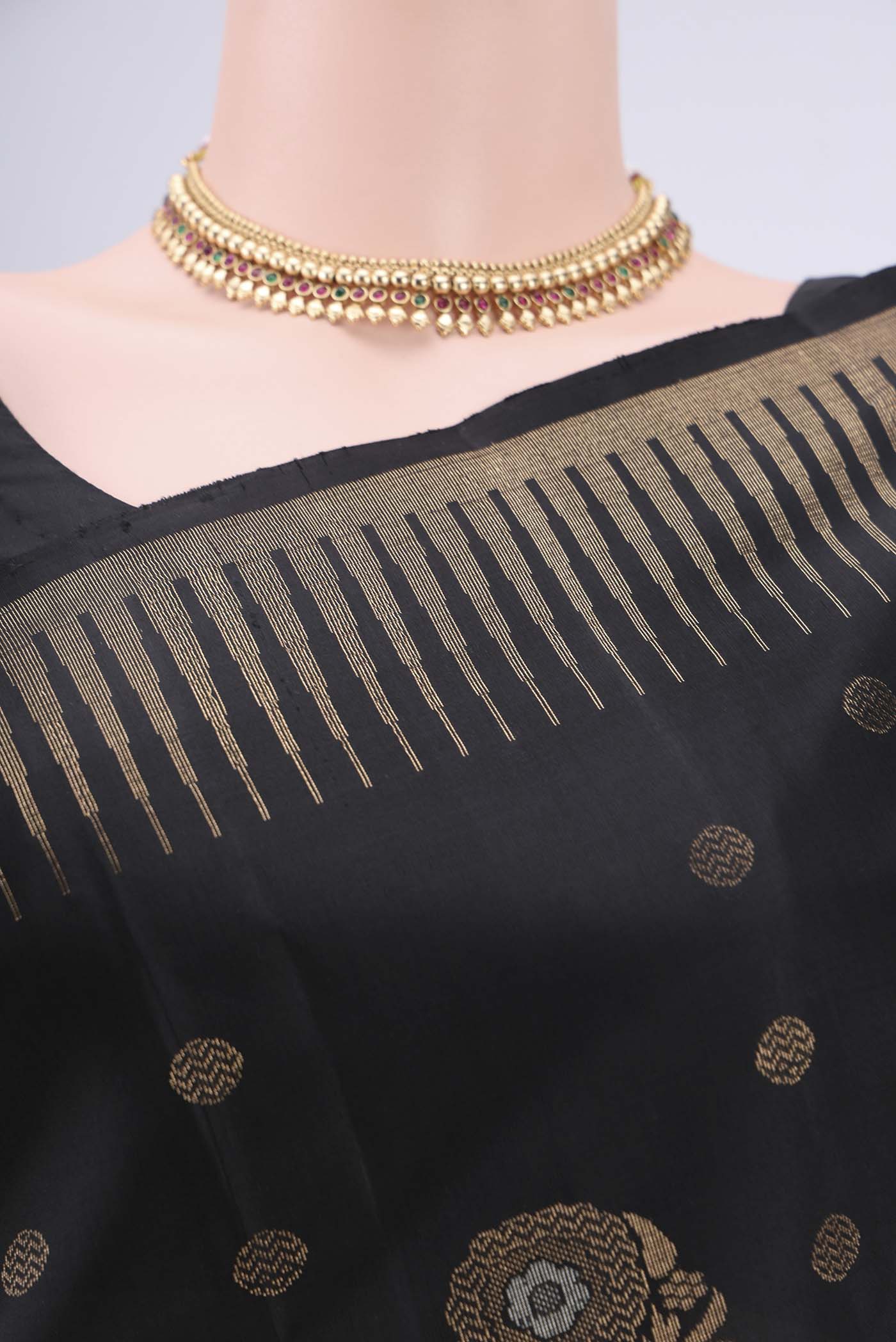Border image of Black Baluchari Silk Saree with Zari Butta on the body and Zari Border. 