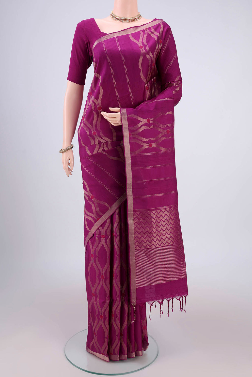 Orange with Pink Dual Tone Soft Silk Saree with Zig Zag design on the body and Zari Border.  displayed on a mannequin