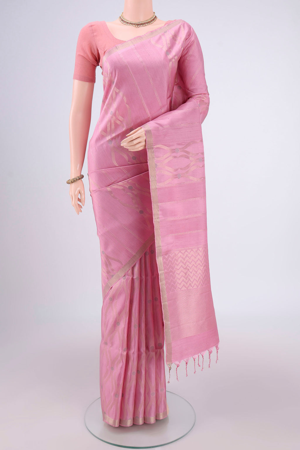 Rose pink Baluchari Silk Saree with Zari Brocade on the body and Zari Border.  displayed on a mannequin