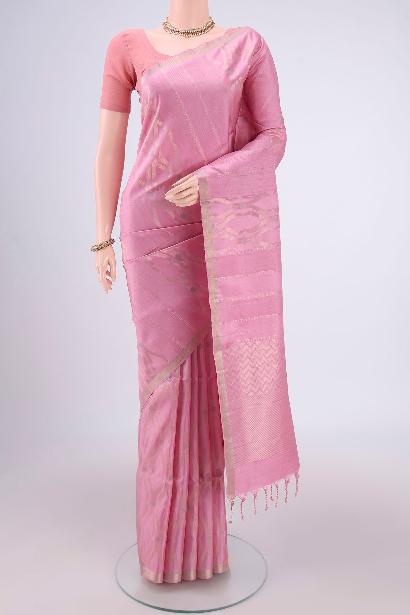 Rose pink Baluchari Silk Saree with Zari Brocade on the body and Zari Border.  displayed on a mannequin