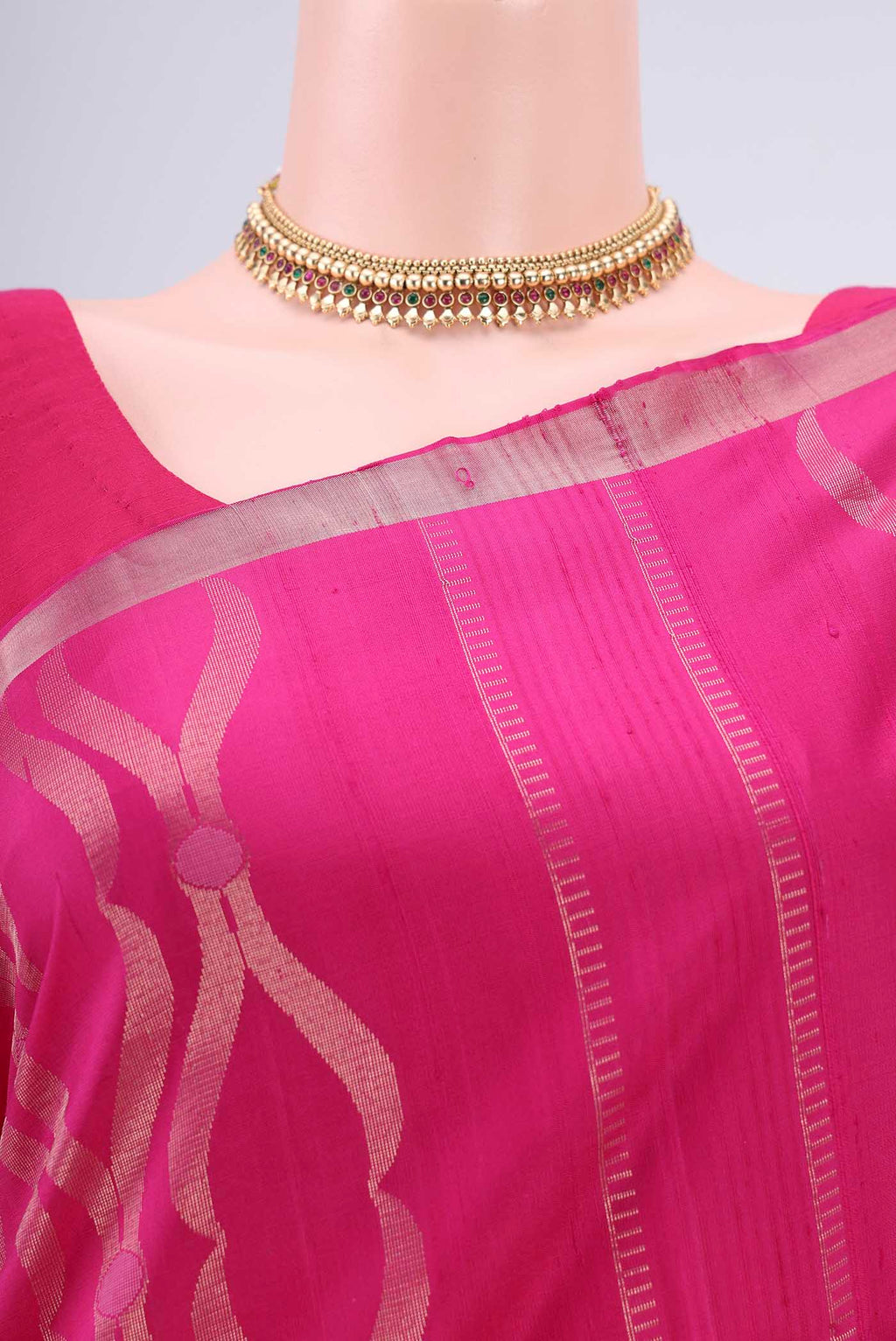 Border image of Rani Pink Soft Silk Saree with Zari Brocade on the body and Zari Border. 
