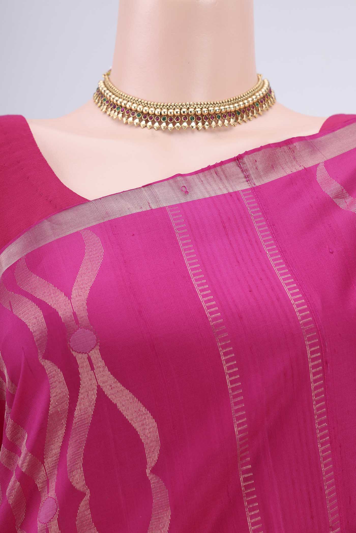 Border image of Rani Pink Soft Silk Saree with Zari Brocade on the body and Zari Border. 