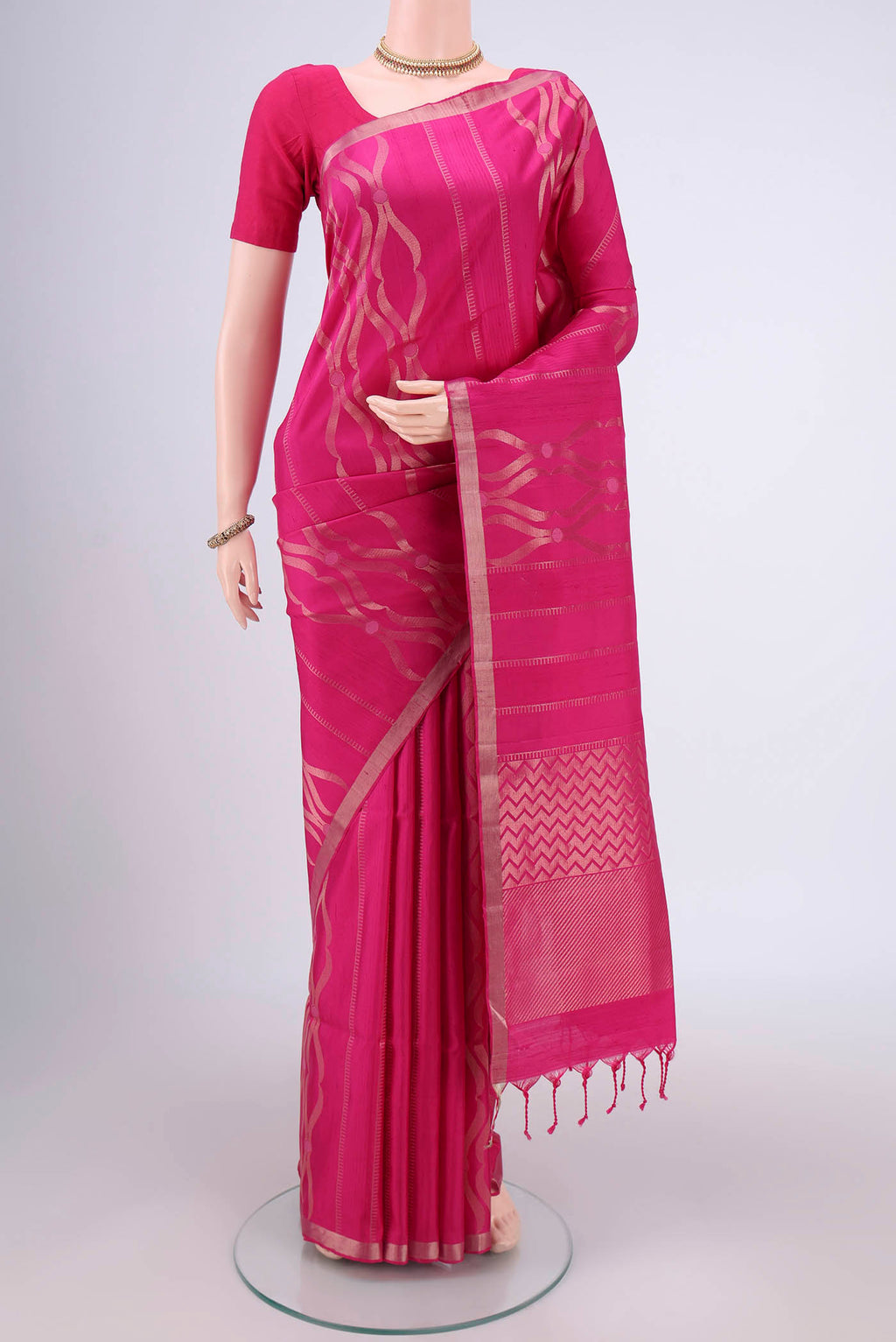 Rani Pink Soft Silk Saree with Zari Brocade on the body and Zari Border.  displayed on a mannequin