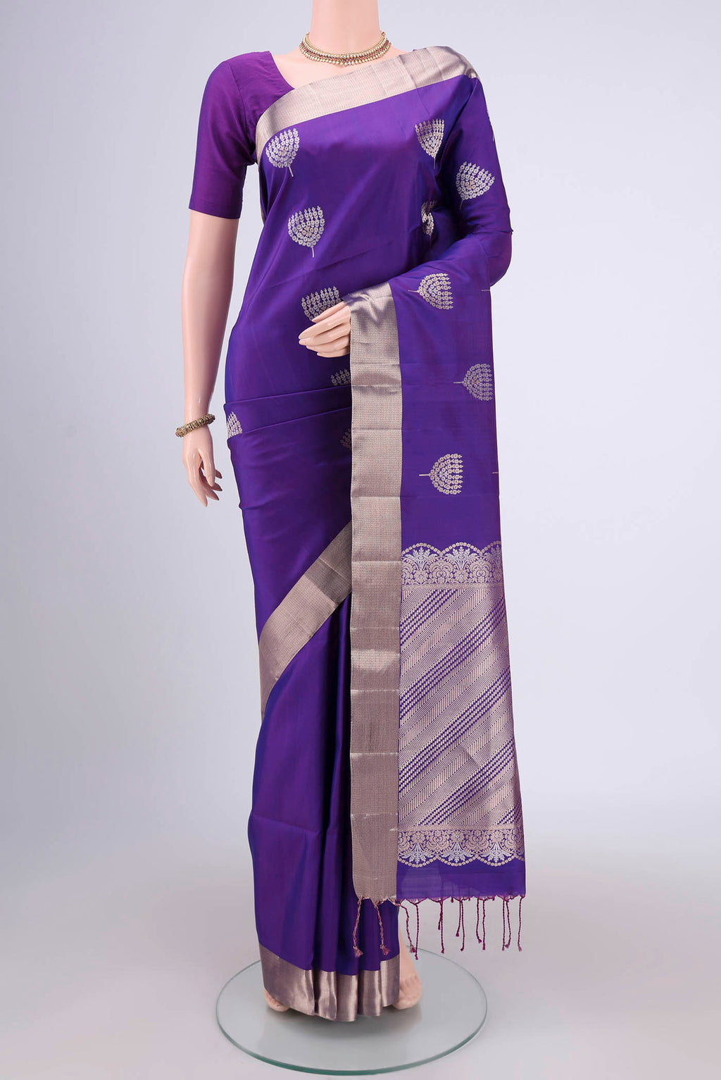 Purple Dual Tone Baluchari Silk Saree with Zari Butta on the body and Zari Border.  displayed on a mannequin