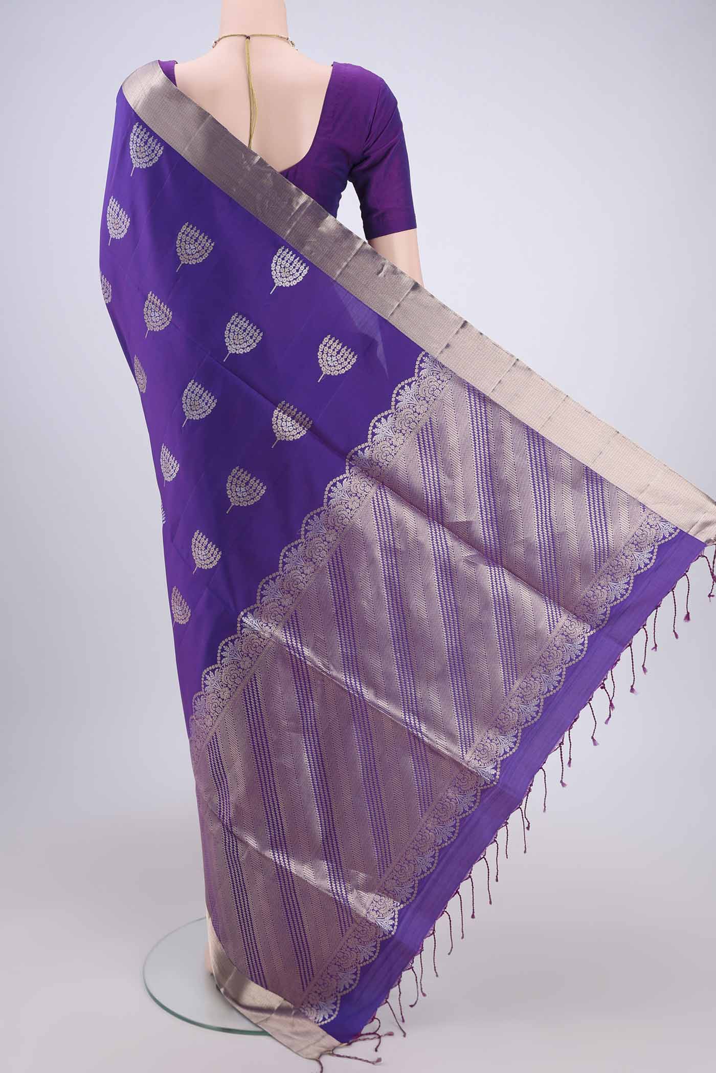 Flat view of Purple Dual Tone Baluchari Silk Saree with Zari Butta on the body and Zari Border. 